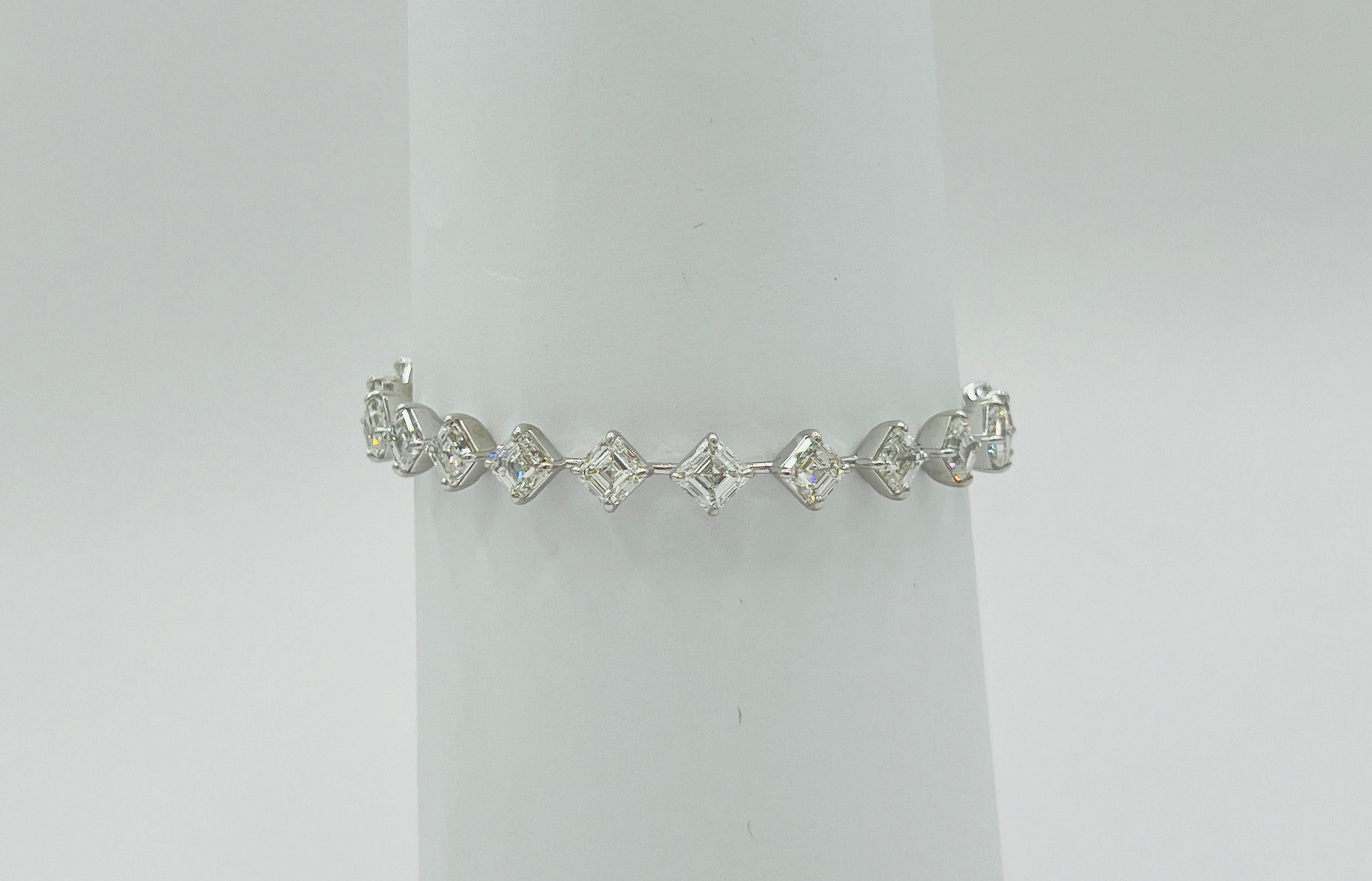 Gorgeous 16.82 ct. GH IF-VS2 white diamond asscher cuts.  Total of 22 stones, 0.70 ct. each.  Handmade in 18k white gold.  Length is 7