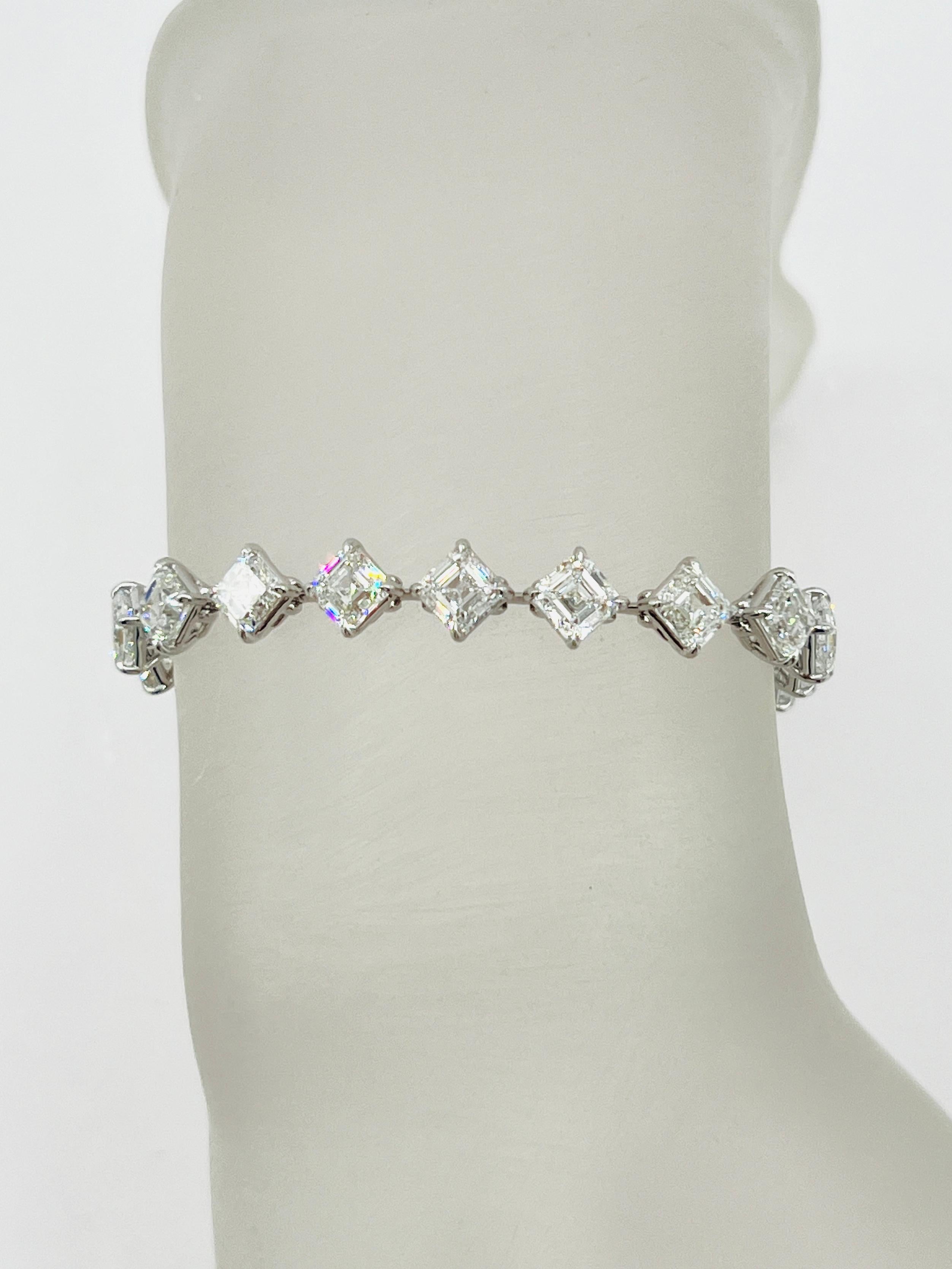 Gorgeous 16.17 ct. DEF VVS-VS white diamond asscher cuts.  Total of 23 stones, each stone weighs 0.70 ct.  Handmade in 18k white gold.  Length is 7