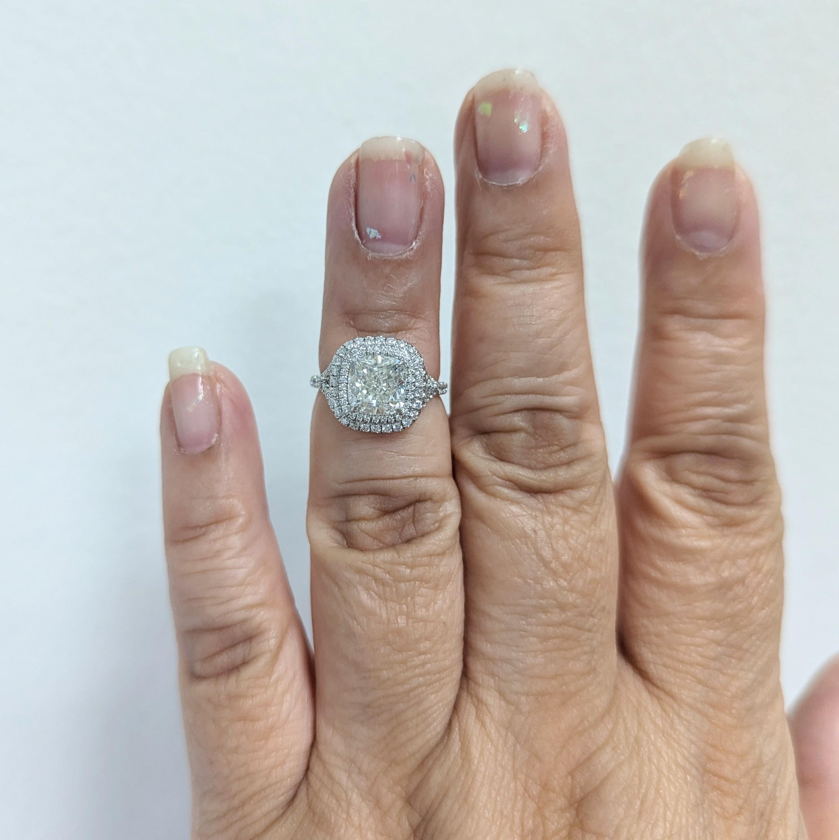 Beautiful 2.02 ct. I color SI1 clarity white diamond cushion with 1.15 ct. good quality white diamond rounds.  Handmade in platinum.  Ring size 5.  GIA certificate included.