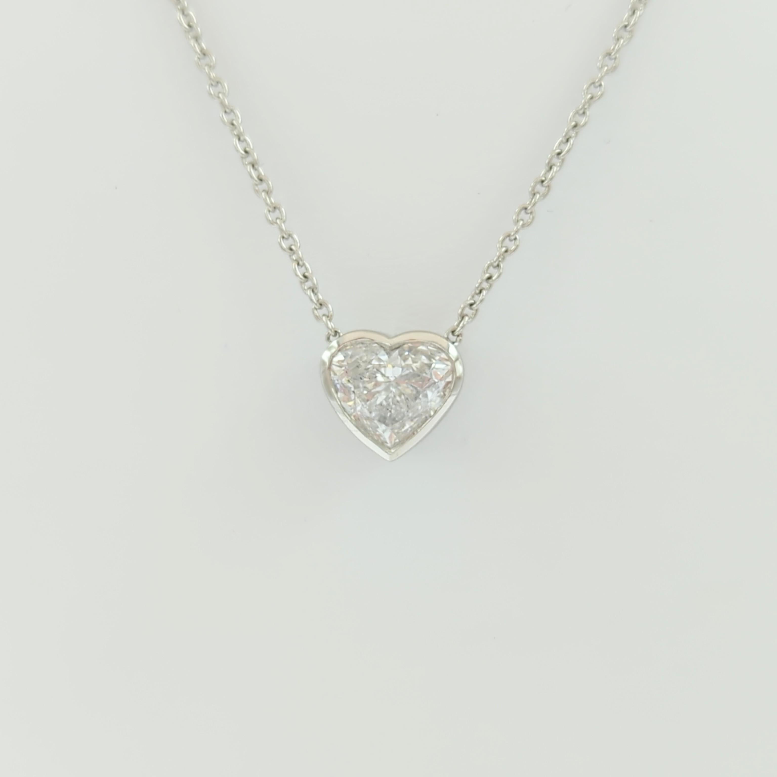 Gorgeous 3.01 ct. E SI2 white diamond heart shape.  Handmade in 18k white gold bezel.  Length of chain is 18