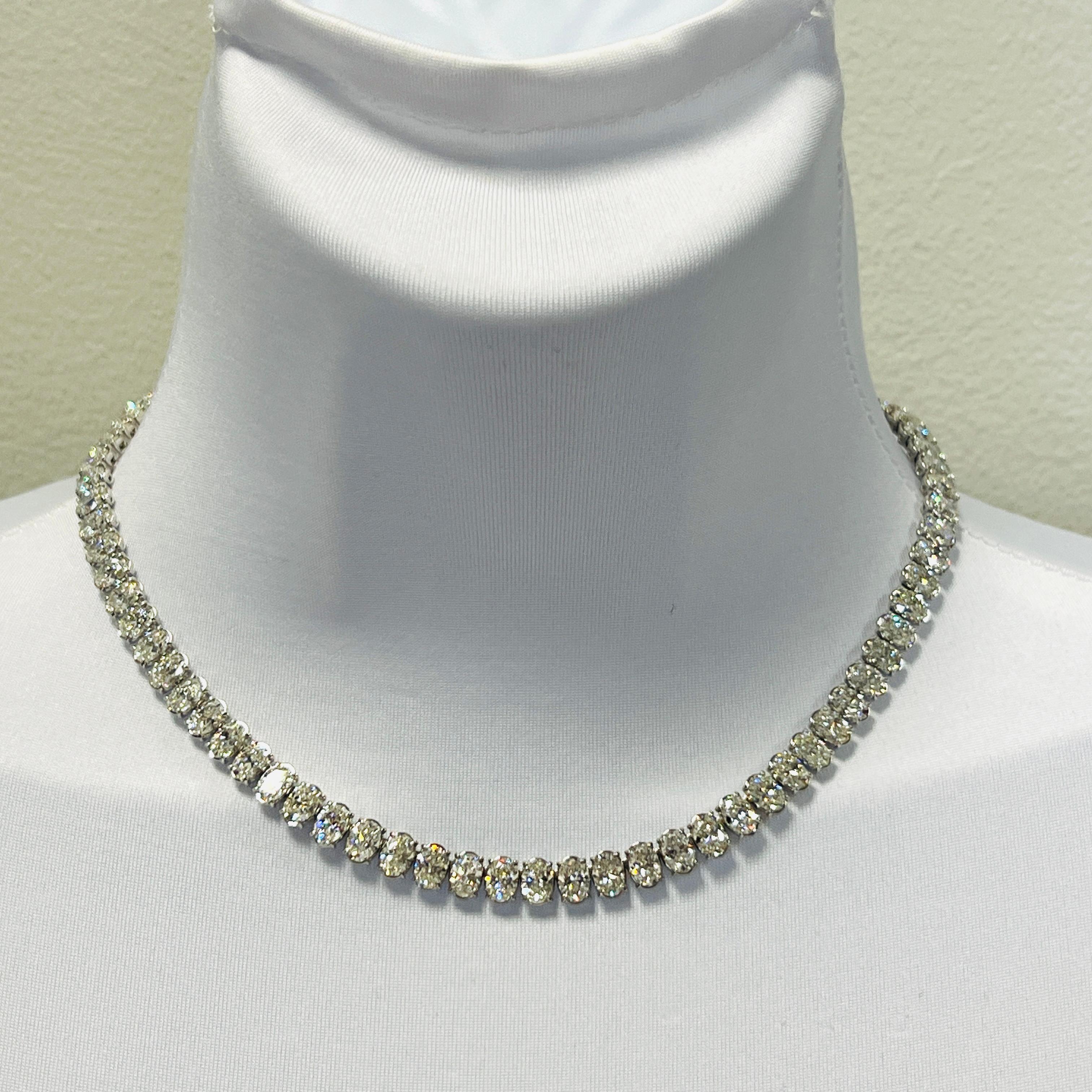Gorgeous 41.61 ct. EFG SI white diamond ovals.  Total of 83 stones, each one is 0.50 ct. Handmade in 18k white gold.  Length is 16