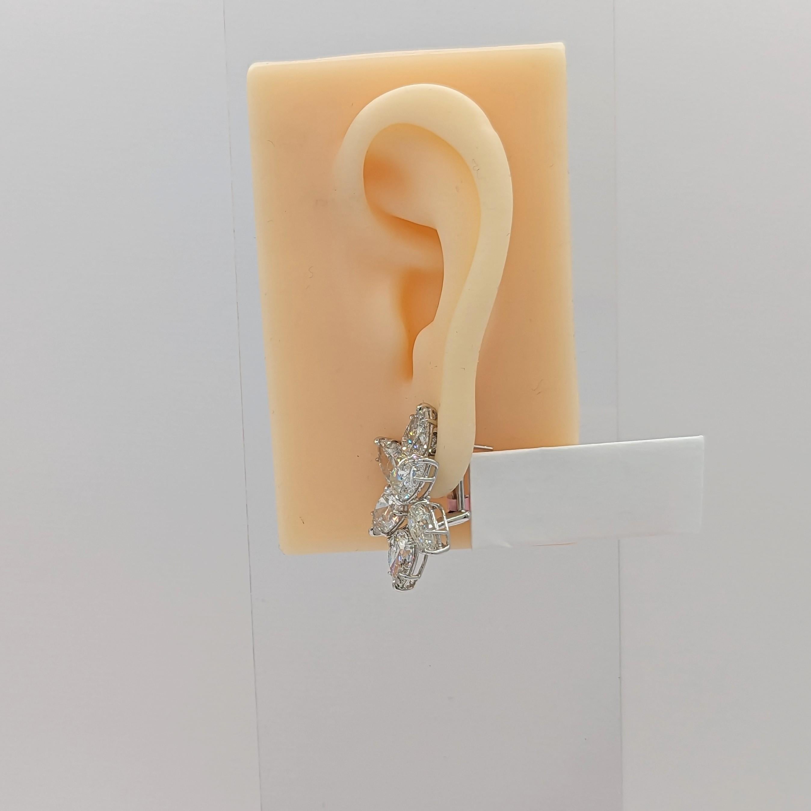 Absolutely stunning cluster diamond earrings featuring 18.12 ct. white diamond pear shapes (total of 12 stones).  Handmade in 18k white gold.  Secure lever back and post closure.  