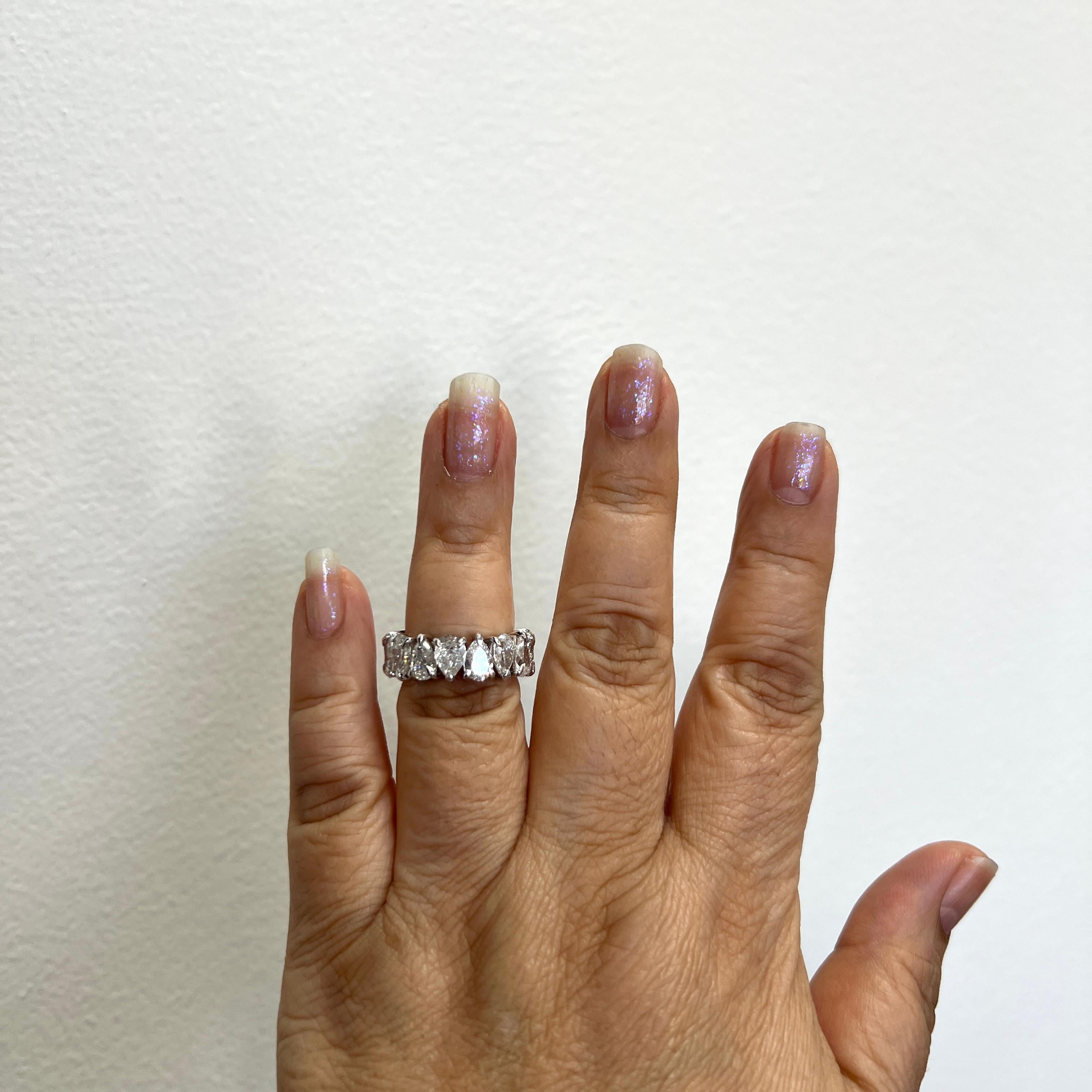 Beautiful 8.06 ct. EF SI white diamond pear shapes.  Total of 16 stones, each one is 0.50 ct.  Handmade in 18k white gold.  Ring size 7.  Each stone comes with a GIA certificate.