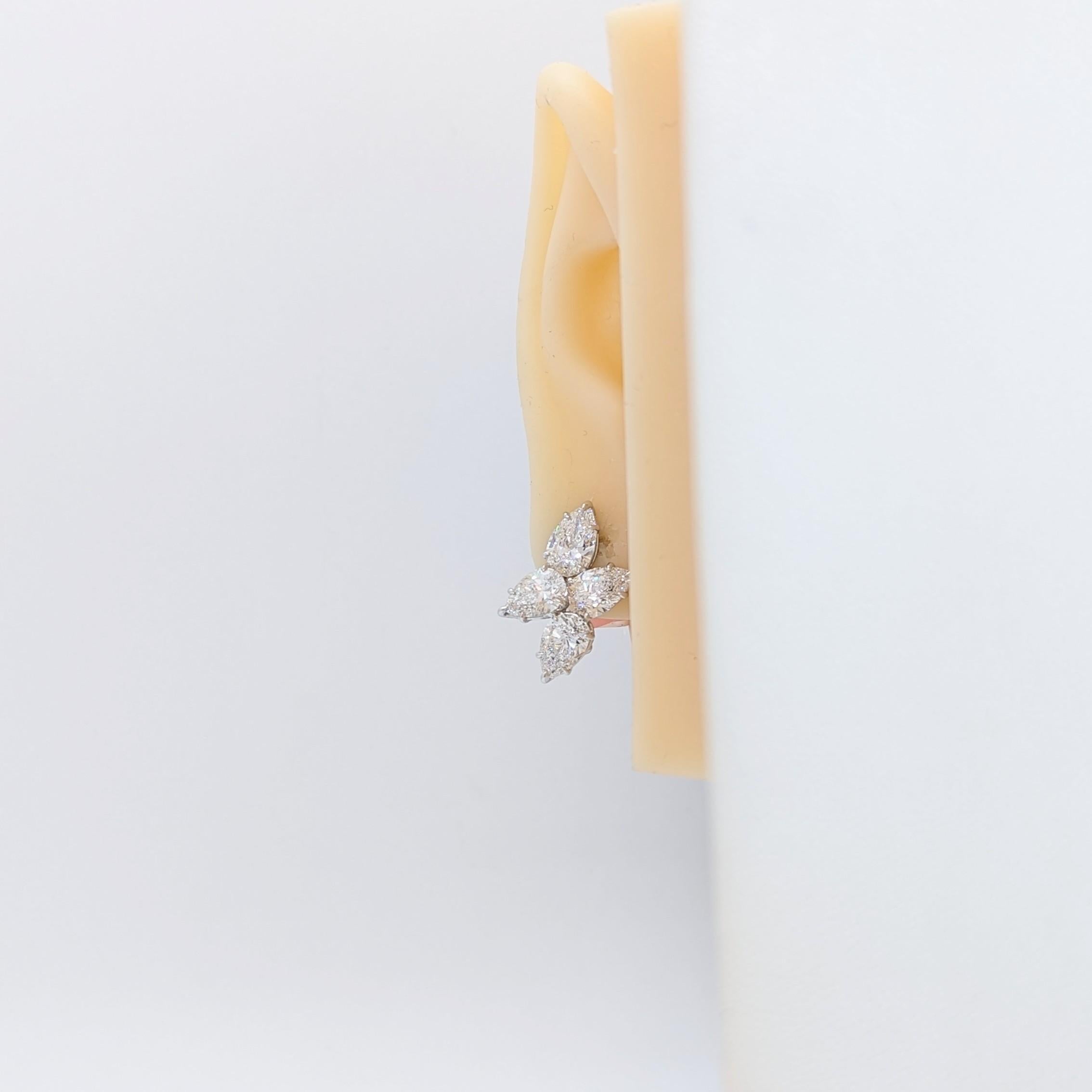 Gorgeous 7.88 ct. DEF SI1-SI2 white diamond pear shapes in a cluster design.  Handmade in 18k white gold.  