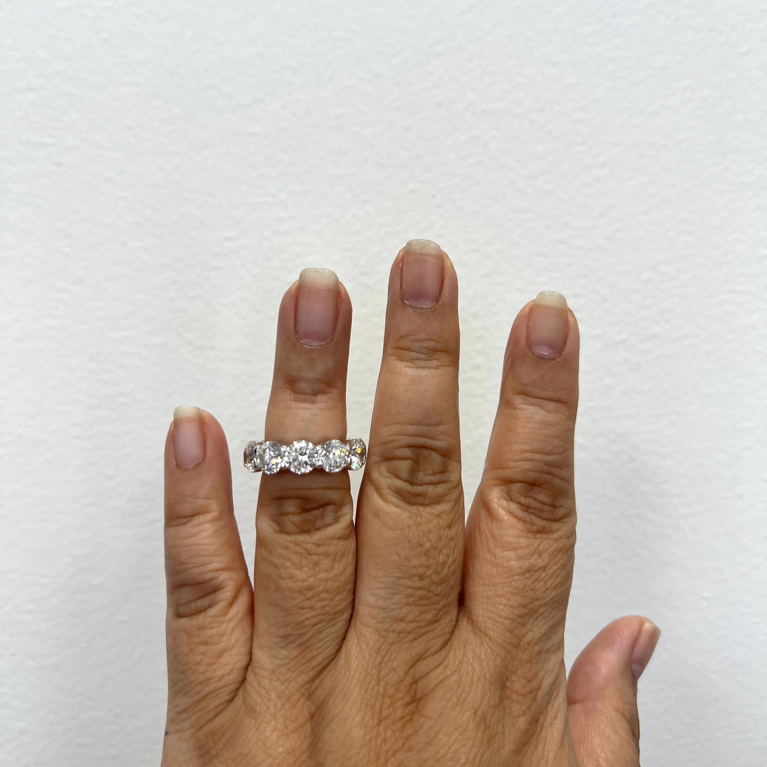 Gorgeous 11.01 ct. GH SI2 white diamond rounds.  Total of 11 stones, 1 carat each.  GIA certificates for each stone included.  Handmade in 18k white gold.  Ring size 6.  Custom rings in your size can be made quickly.
