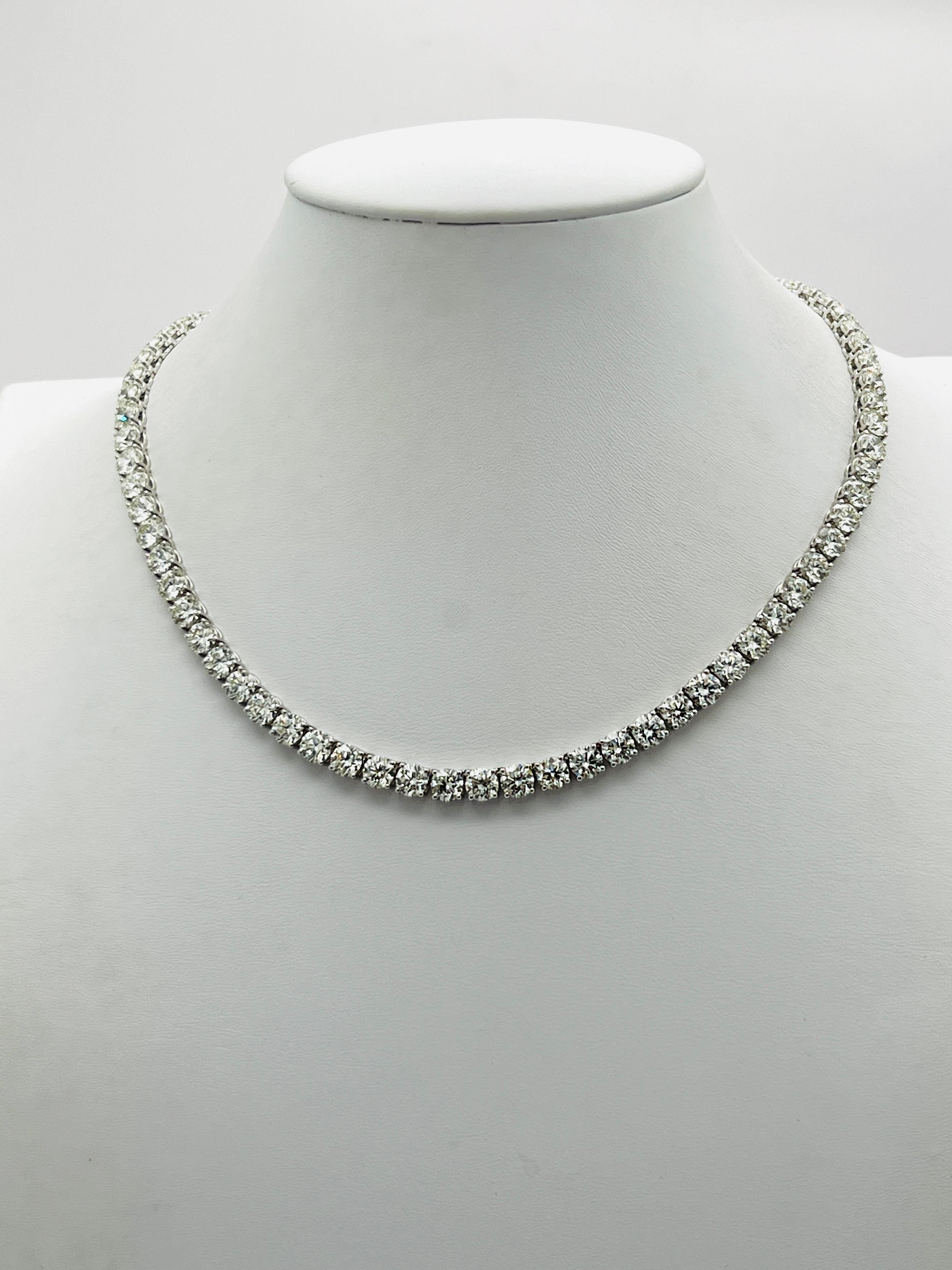Stunning 38.28 ct. JK VVS2-SI2 white diamond rounds.  Total of 76 stones, each one weighs 0.50 ct.  Handmade in 18k white gold.  Length is 15