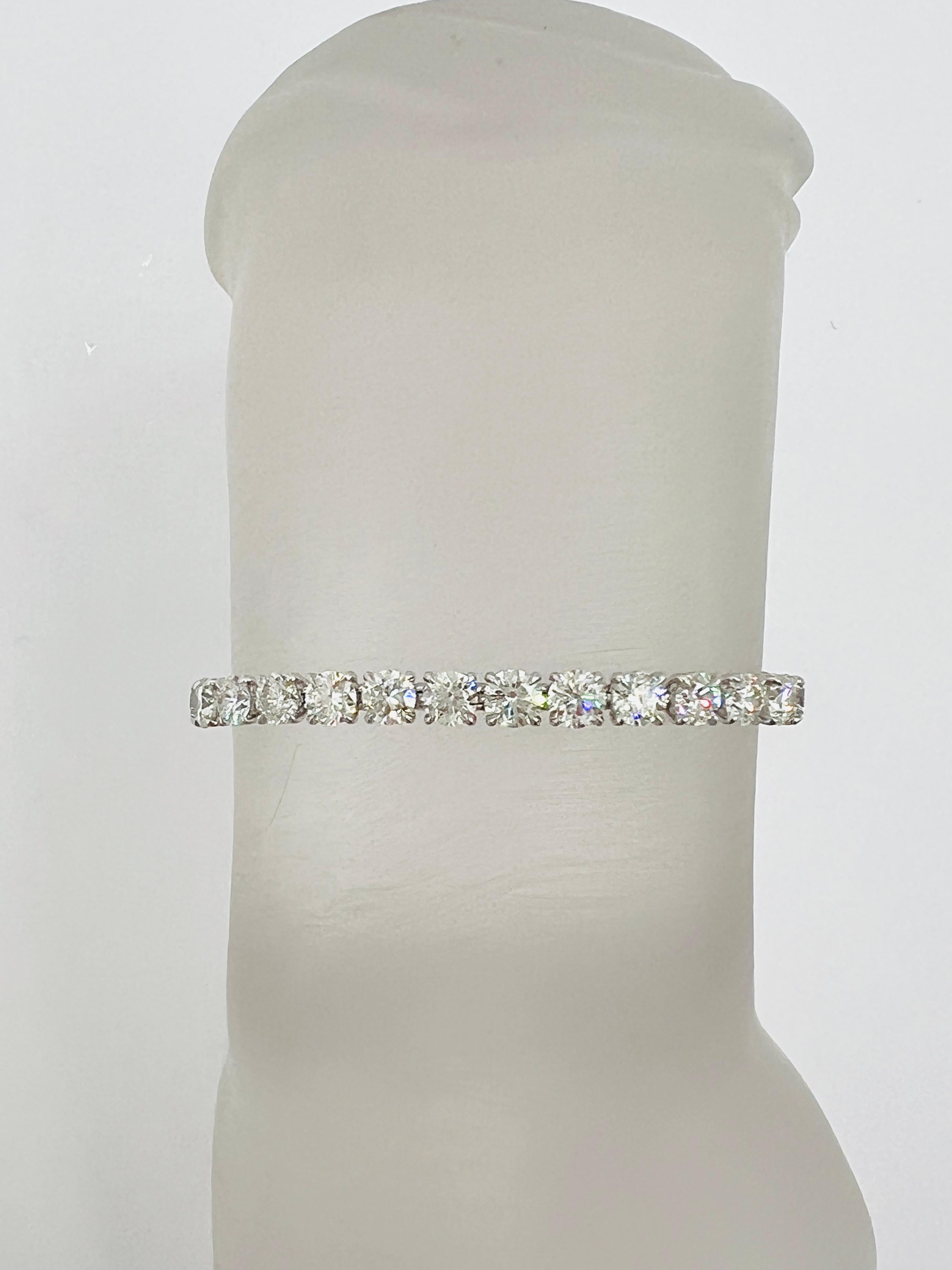 Stunning 11.34 ct. I-J SI white diamond rounds.  total of 37 stones, each one is 0.30 ct.  All stones come with a GIA certificate.  Handmade in 18k white gold.  Length is 6.5