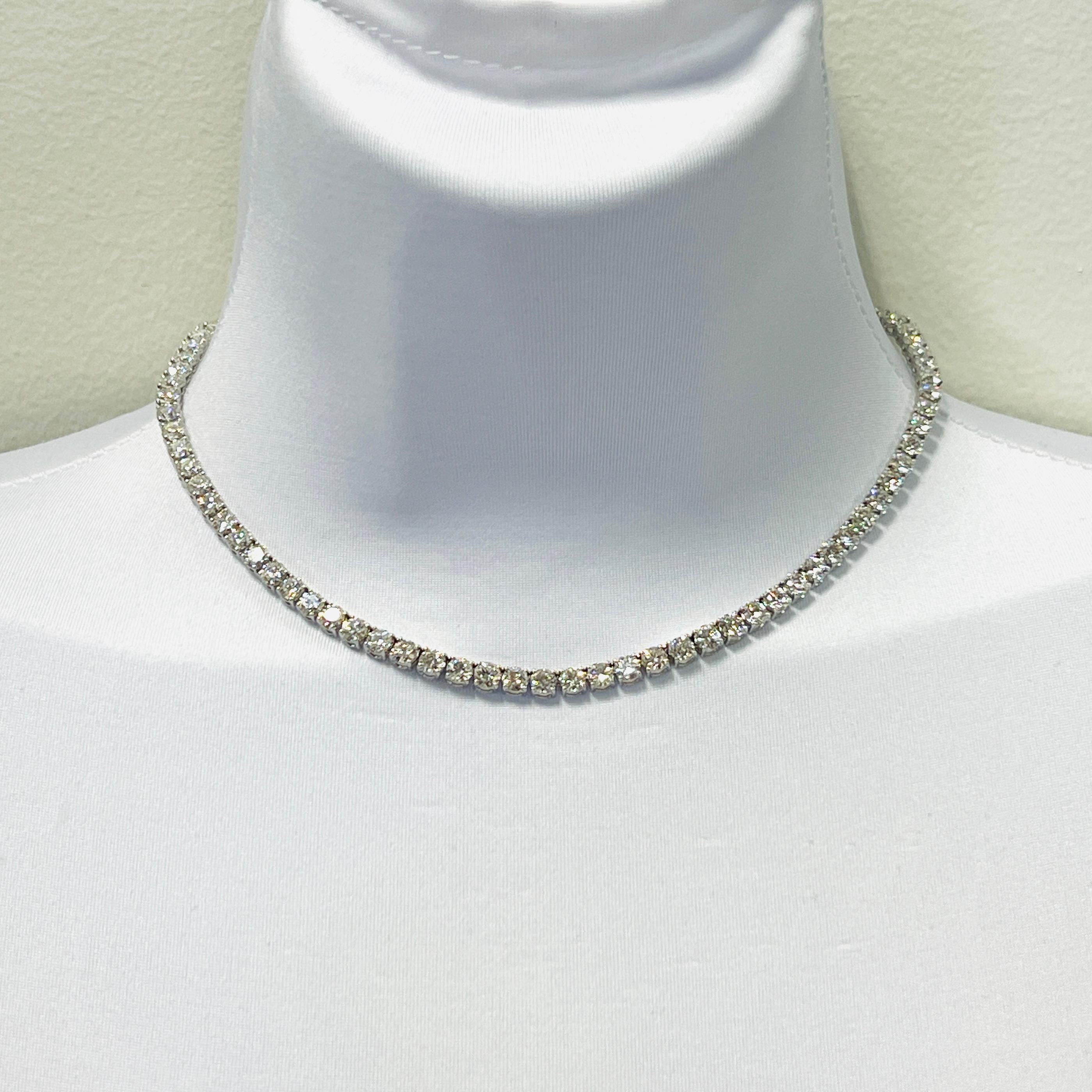 Gorgeous 24.92 ct. EFG VS1-SI2 white diamond rounds.  Total of 83 stones.  Handmade in 18k white gold.  Length is 14.5