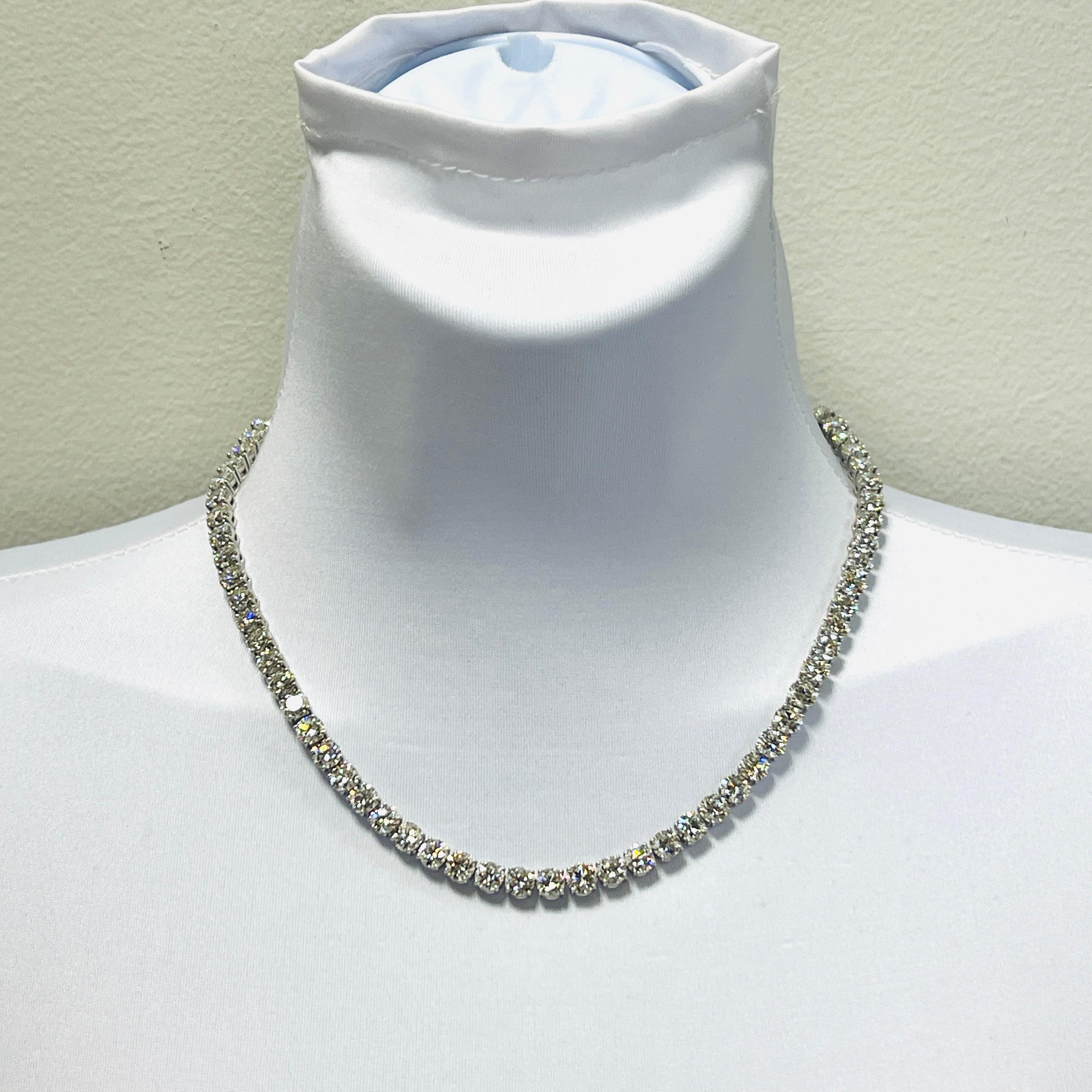 Gorgeous 47.65 ct. IJ VVS-SI white diamond rounds.  Total of 68 stones, 0.70 ct. each.  Handmade in 18k white gold.  Length is 16