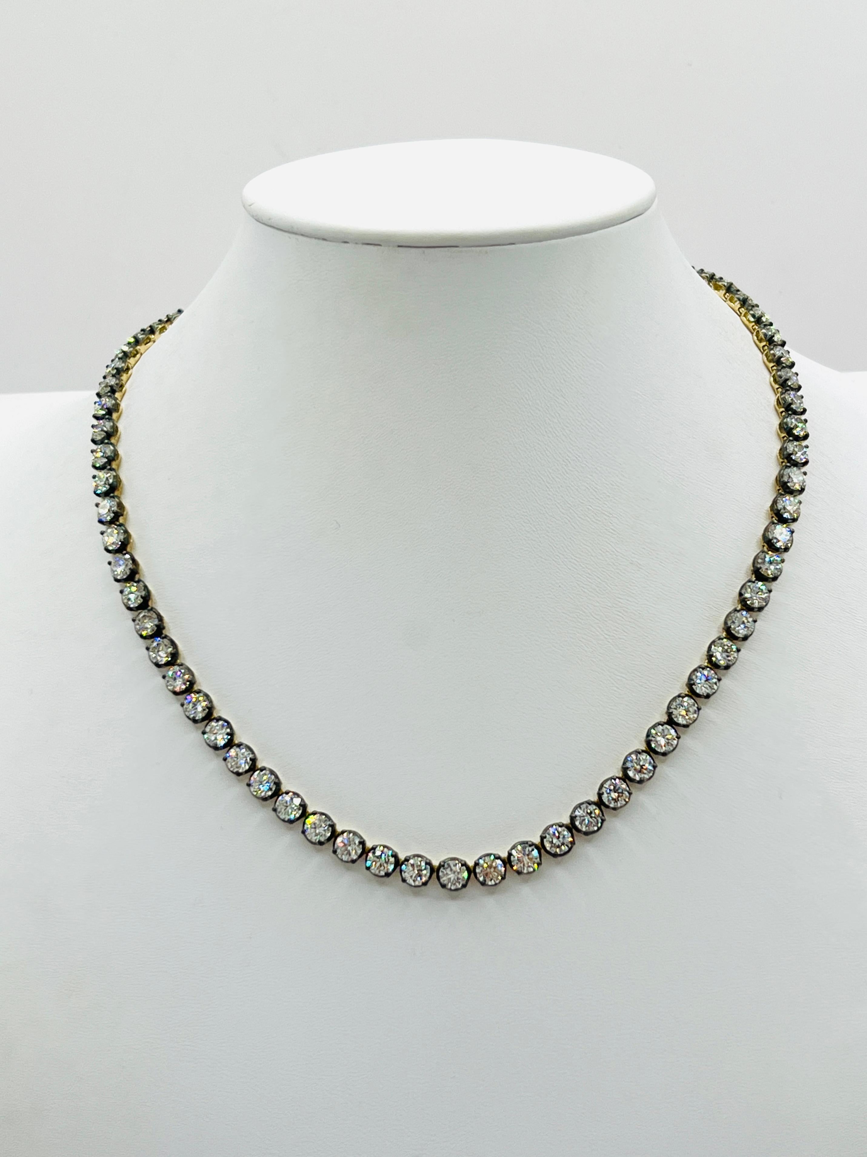 Gorgeous 21.60 ct. I VVS-SI white diamond rounds.  Total of 72 stones, each one is 0.30 ct.  Each stone comes with a GIA certificate.  Handmade in black rhodium and 18k yellow gold.  Length is 15