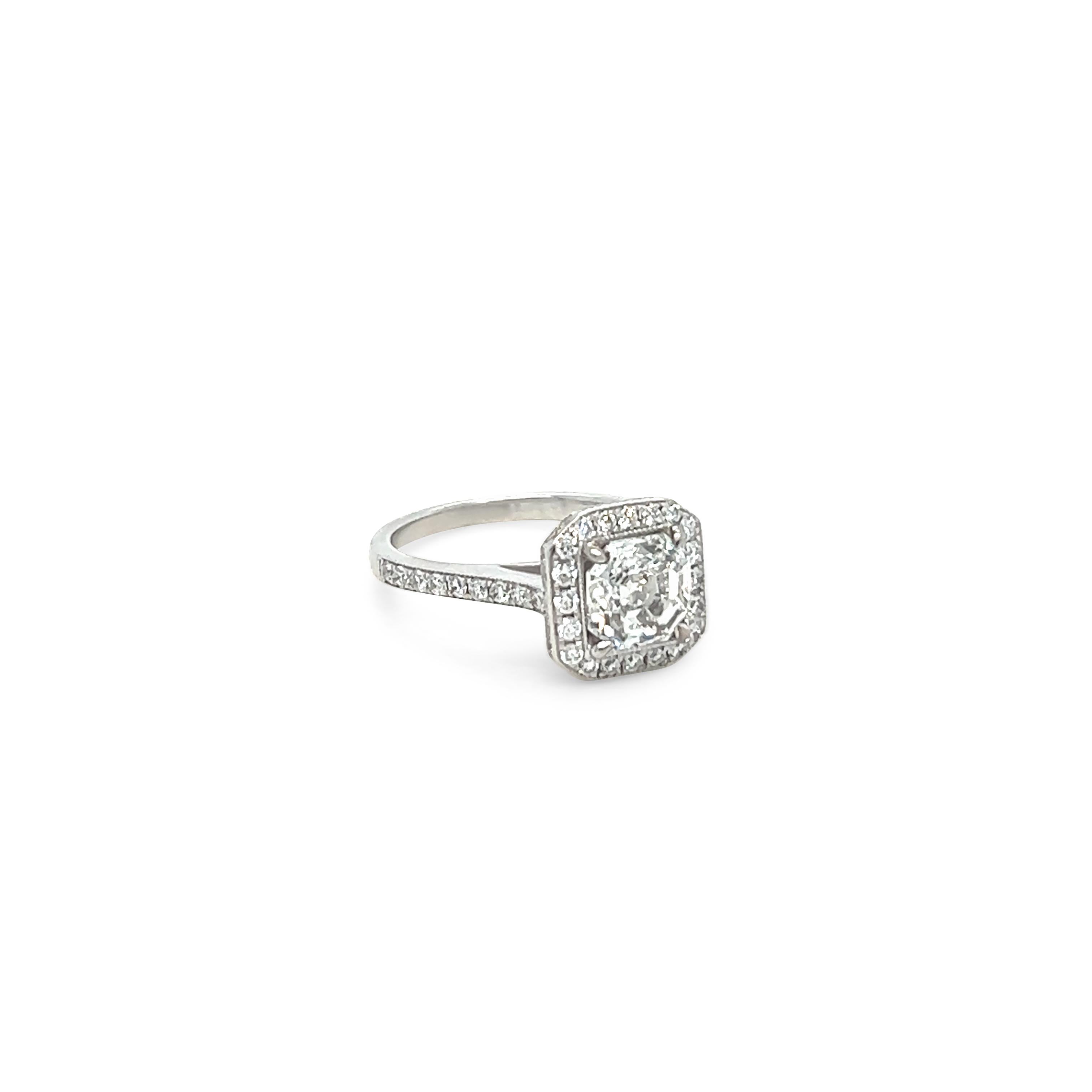 Unique features: 
GIA White Gold Asscher Cut Engagement Ring 1.56ct

18ct white gold, combination machine and handmade halo style diamond.

Surrounding the central Asscher cut diamond, in a bead set frame, are twenty round brilliant cut diamonds,