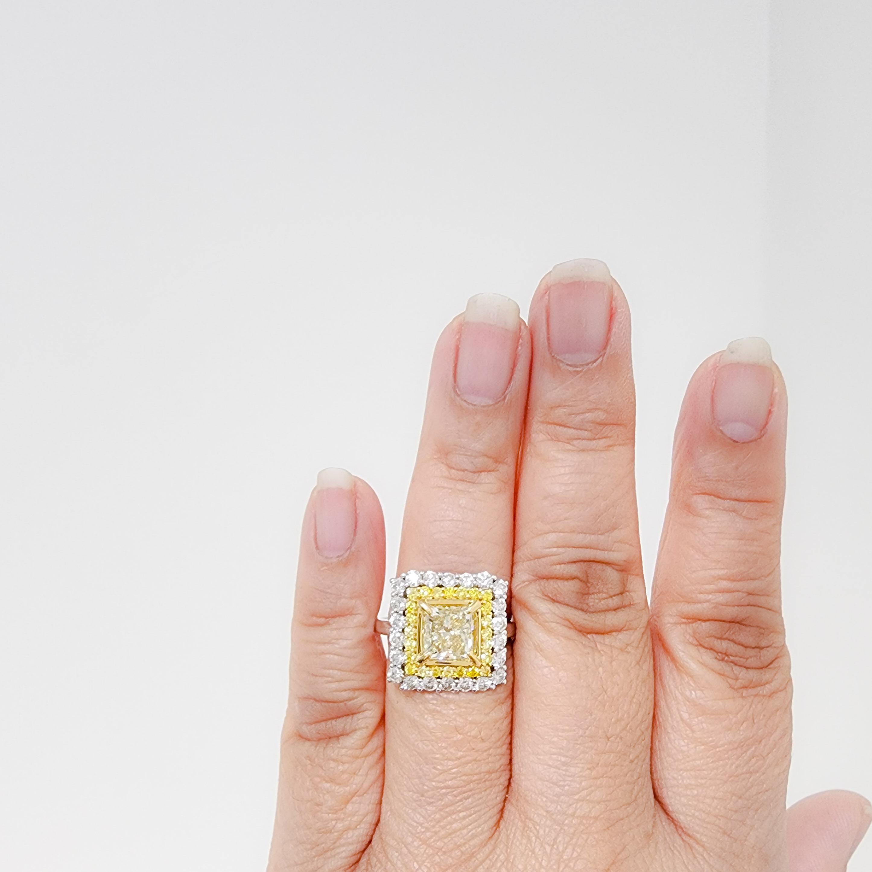 Beautiful 2.50 ct. Y to Z color VS2 clarity diamond princess cut with good quality white diamond rounds and natural yellow diamond rounds.  Handmade in 18k yellow and white gold.  Ring size 10.
GIA certificate included.