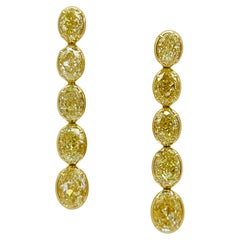 GIA Orecchini a castone con diamante giallo ovale in oro giallo 18 carati