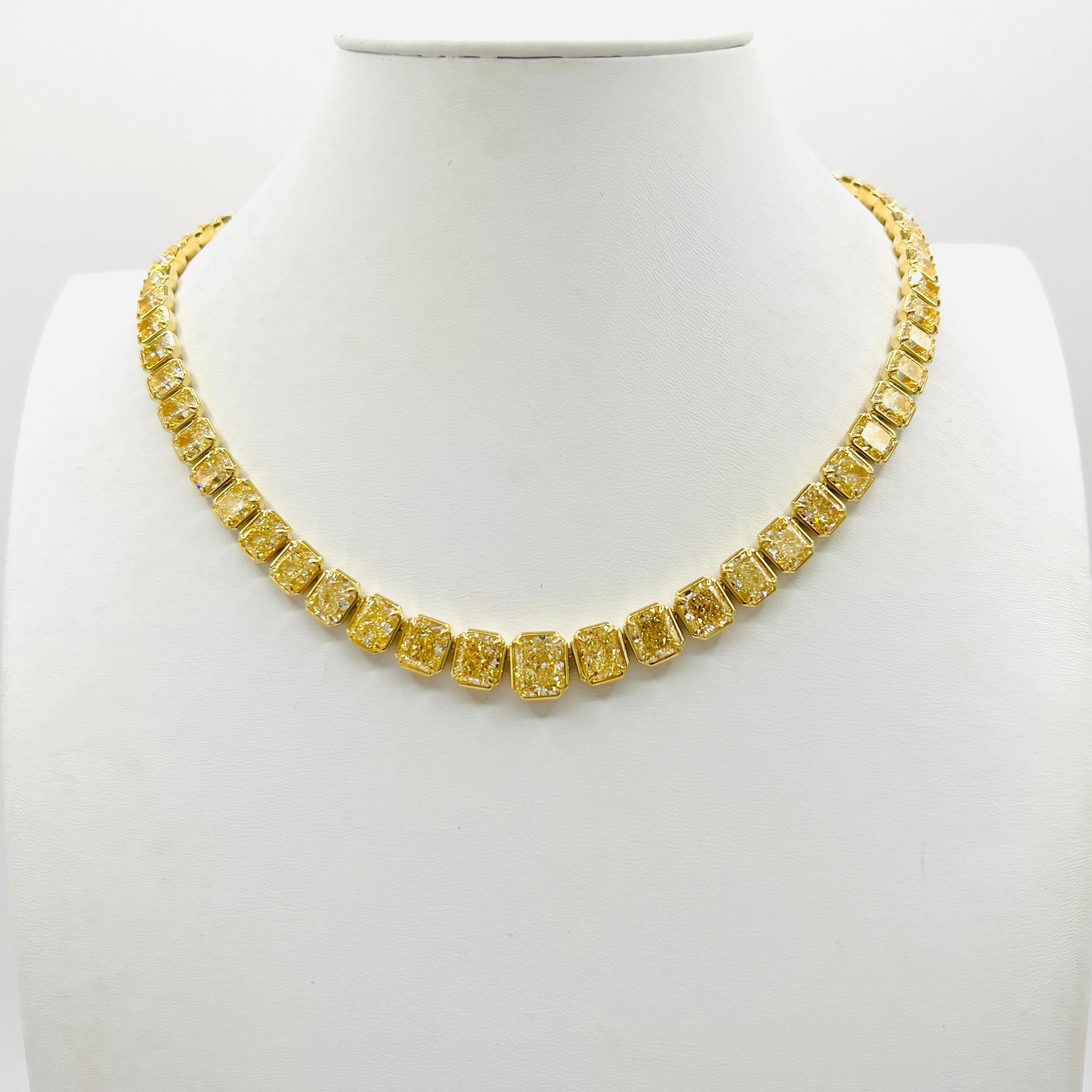 Absolutely stunning 71.22 ct. S-Z VVS-SI yellow diamond radiants. The diamonds range from 0.90 ct. (in the back) to 3.01 ct. in the center.  Handmade in 18k yellow gold.  Length is 16.25