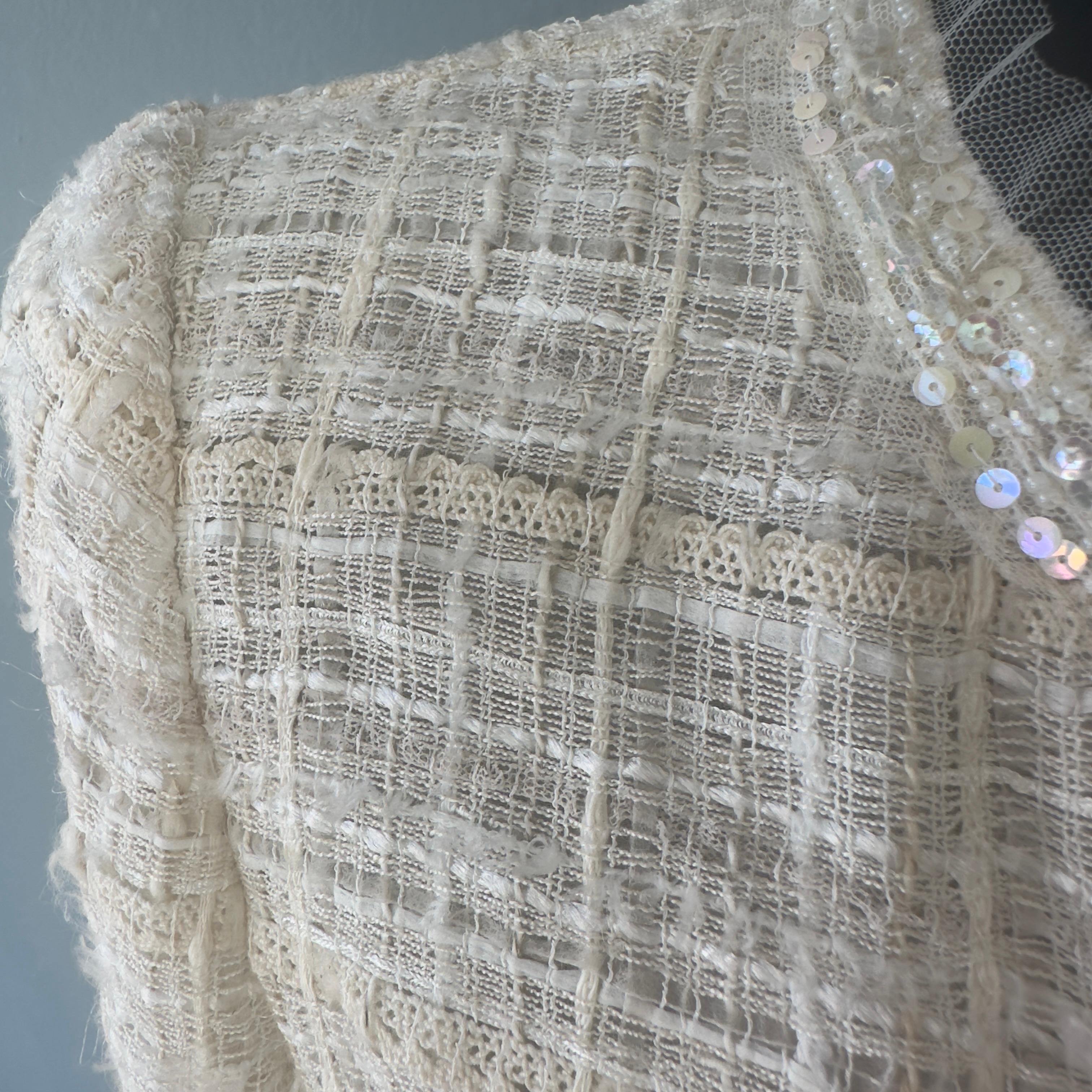 Chanel jacket worked with camellia brooch 8