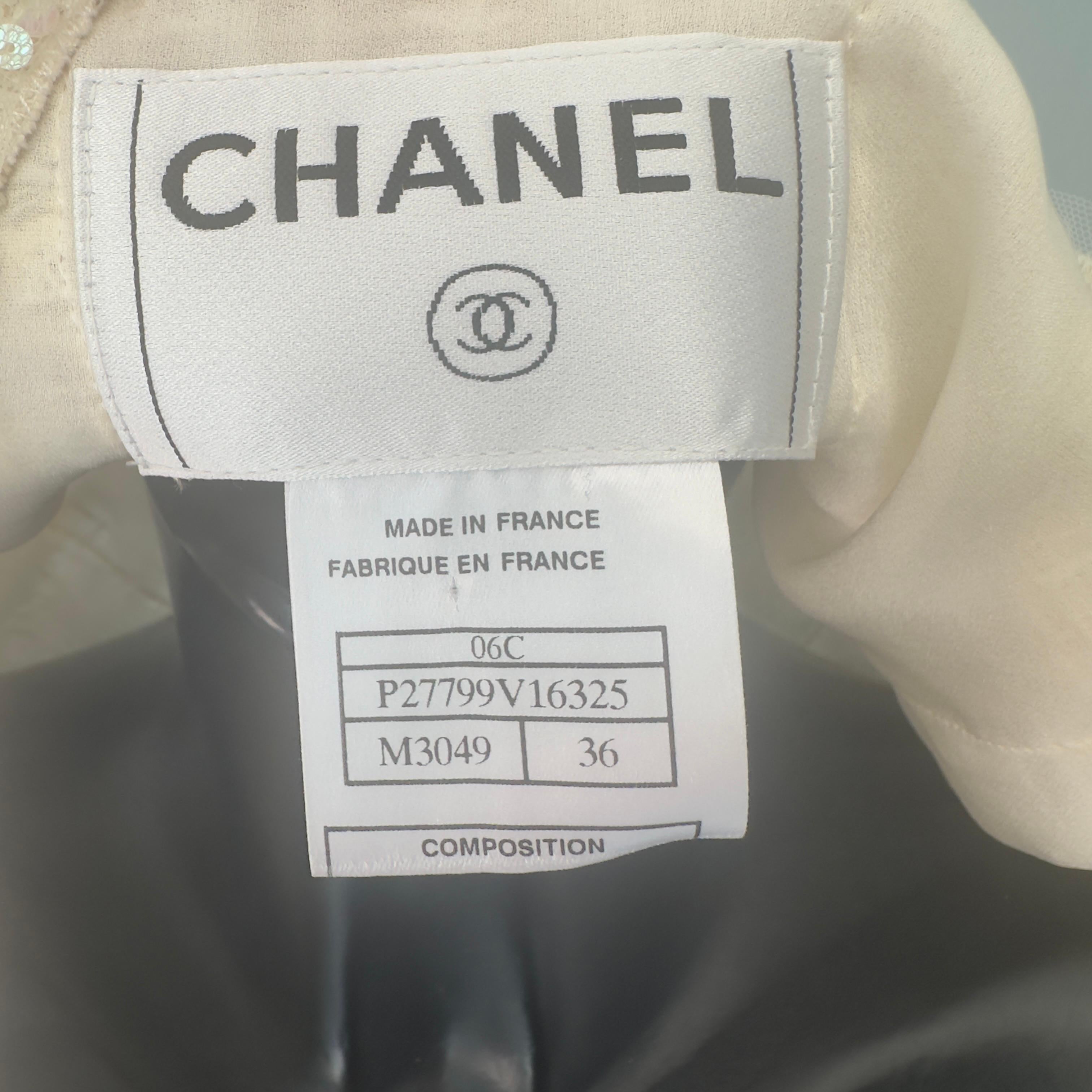 Chanel jacket worked with camellia brooch 9