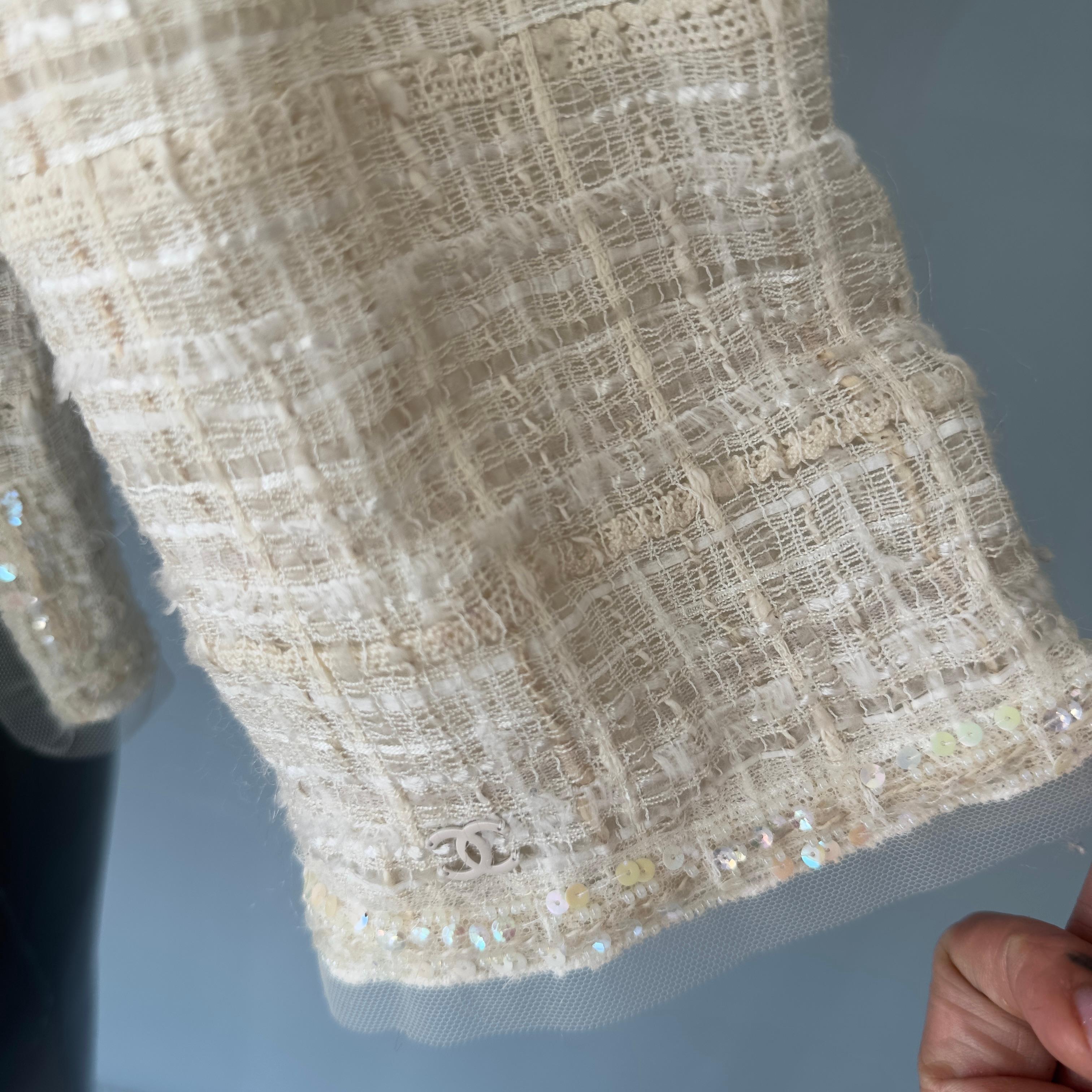 Chanel jacket worked with camellia brooch 1