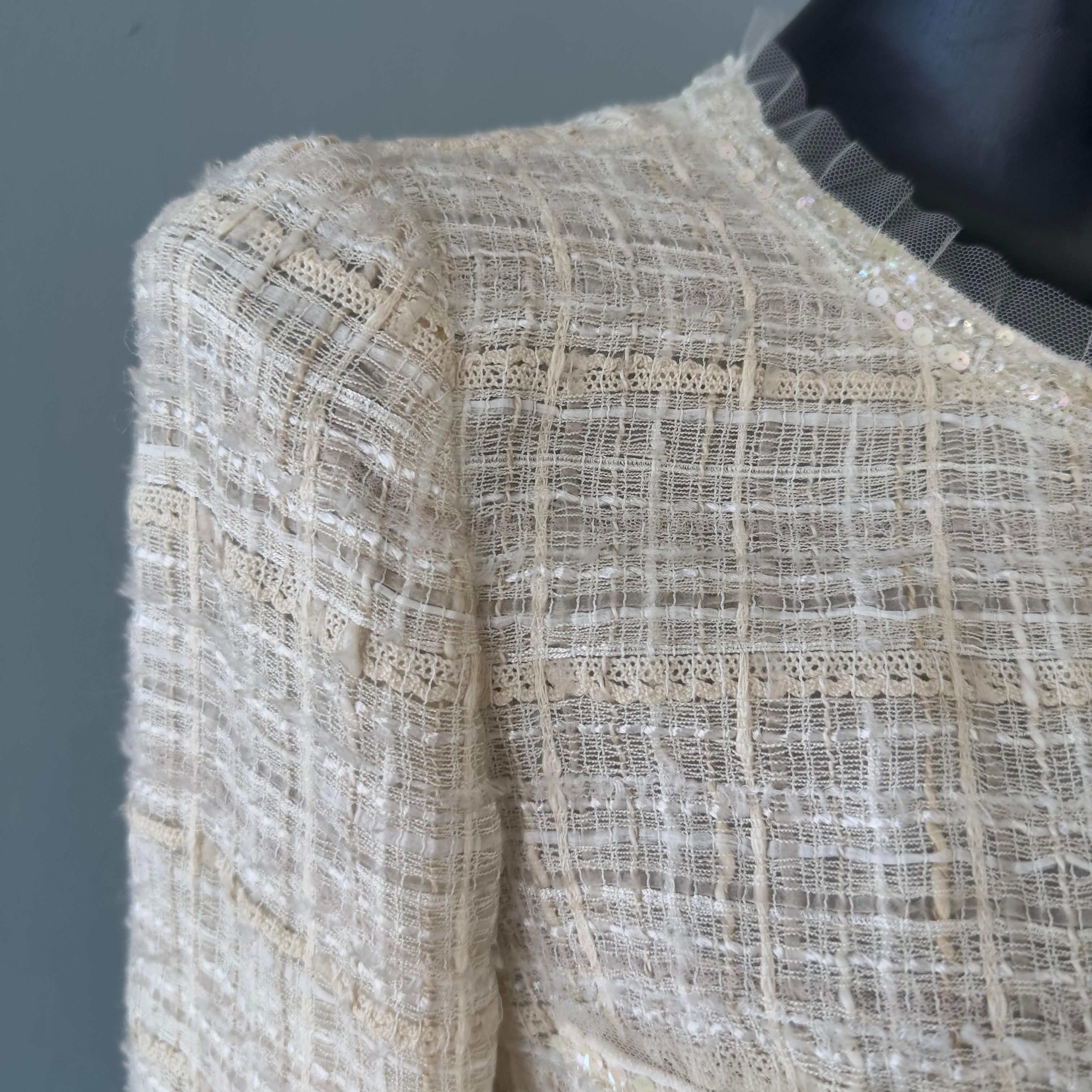 Chanel jacket worked with camellia brooch 2