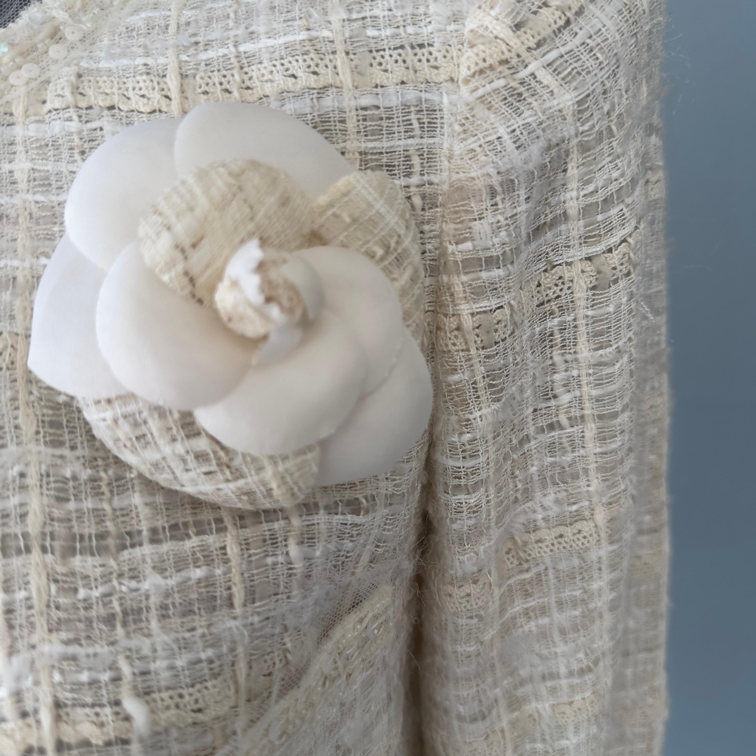 Chanel jacket worked with camellia brooch 4