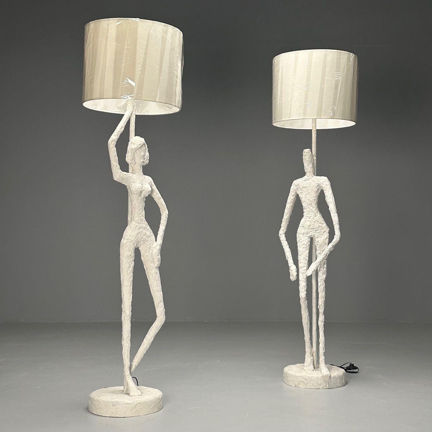 Giacometti Inspired, Contemporary, White Floor Lamps, Plaster, Wood, 2024

This captivating pair of plaster floor lamps, inspired by the work of Giacometti, features striking representations of a man and a woman. Each lamp showcases a unique white