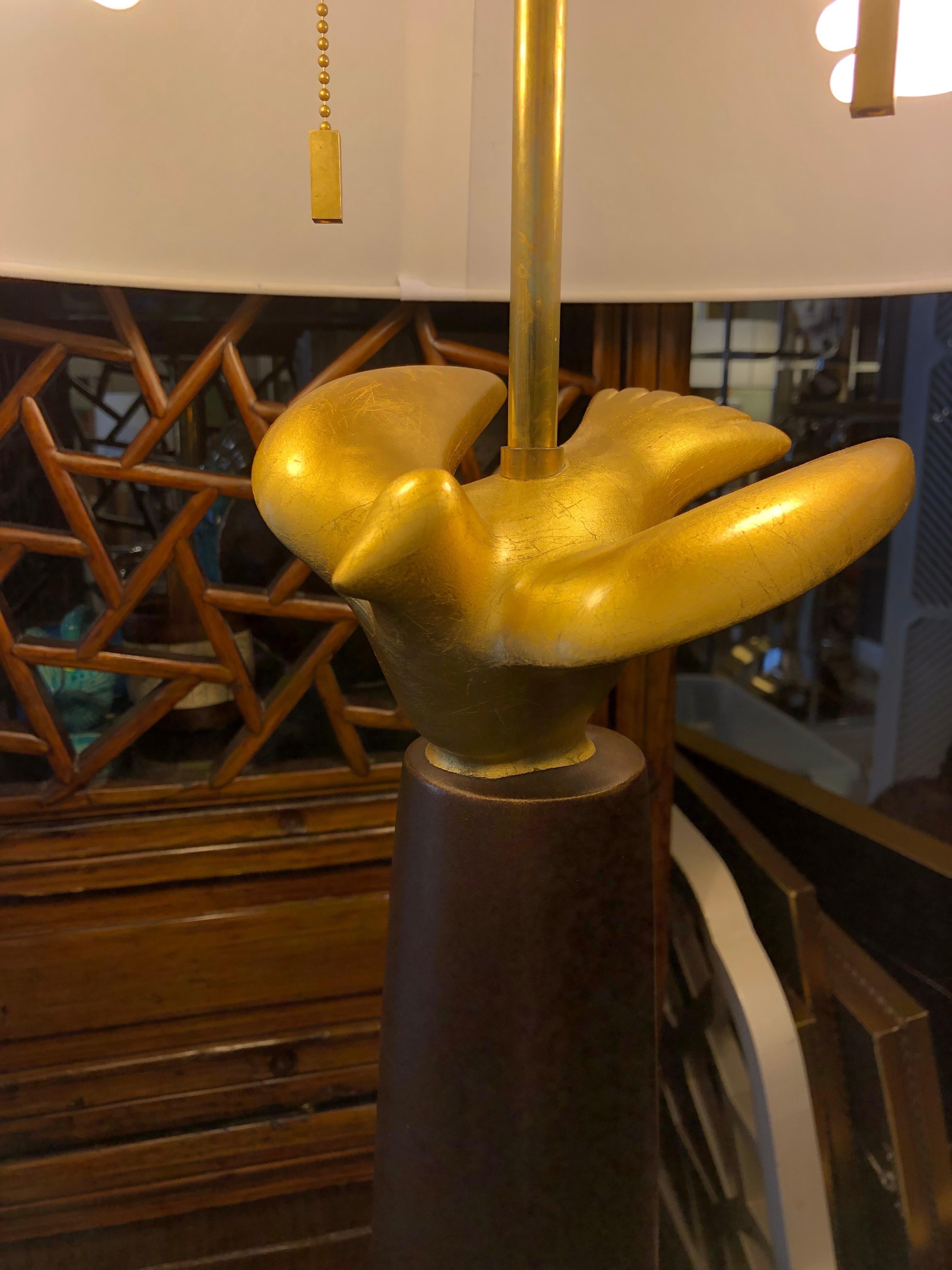 Late 20th century Sirmos column table lamp having a figural gilt dove.