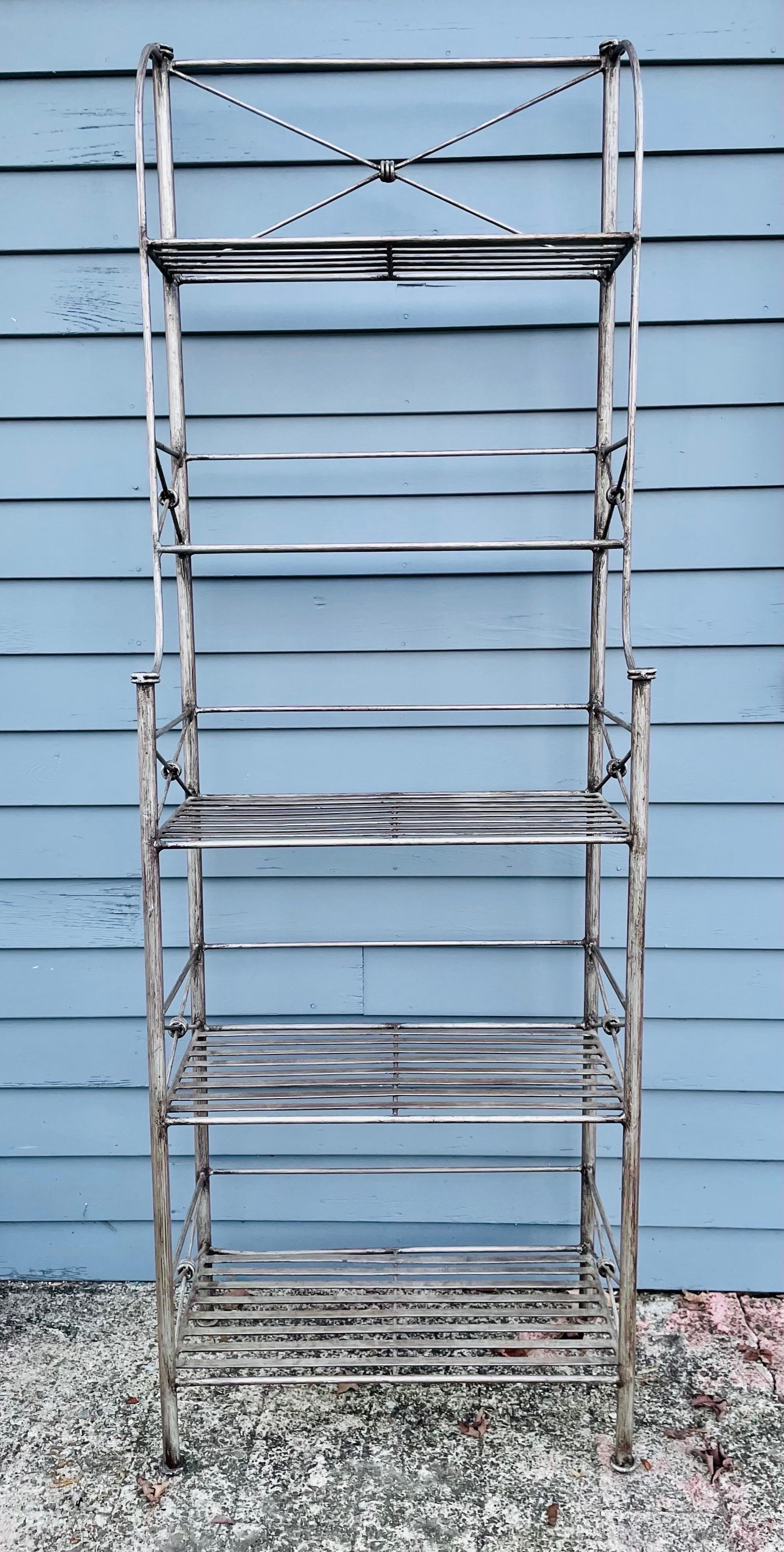 Neoclassical Giacometti inspired wrought iron Bakers Rack For Sale