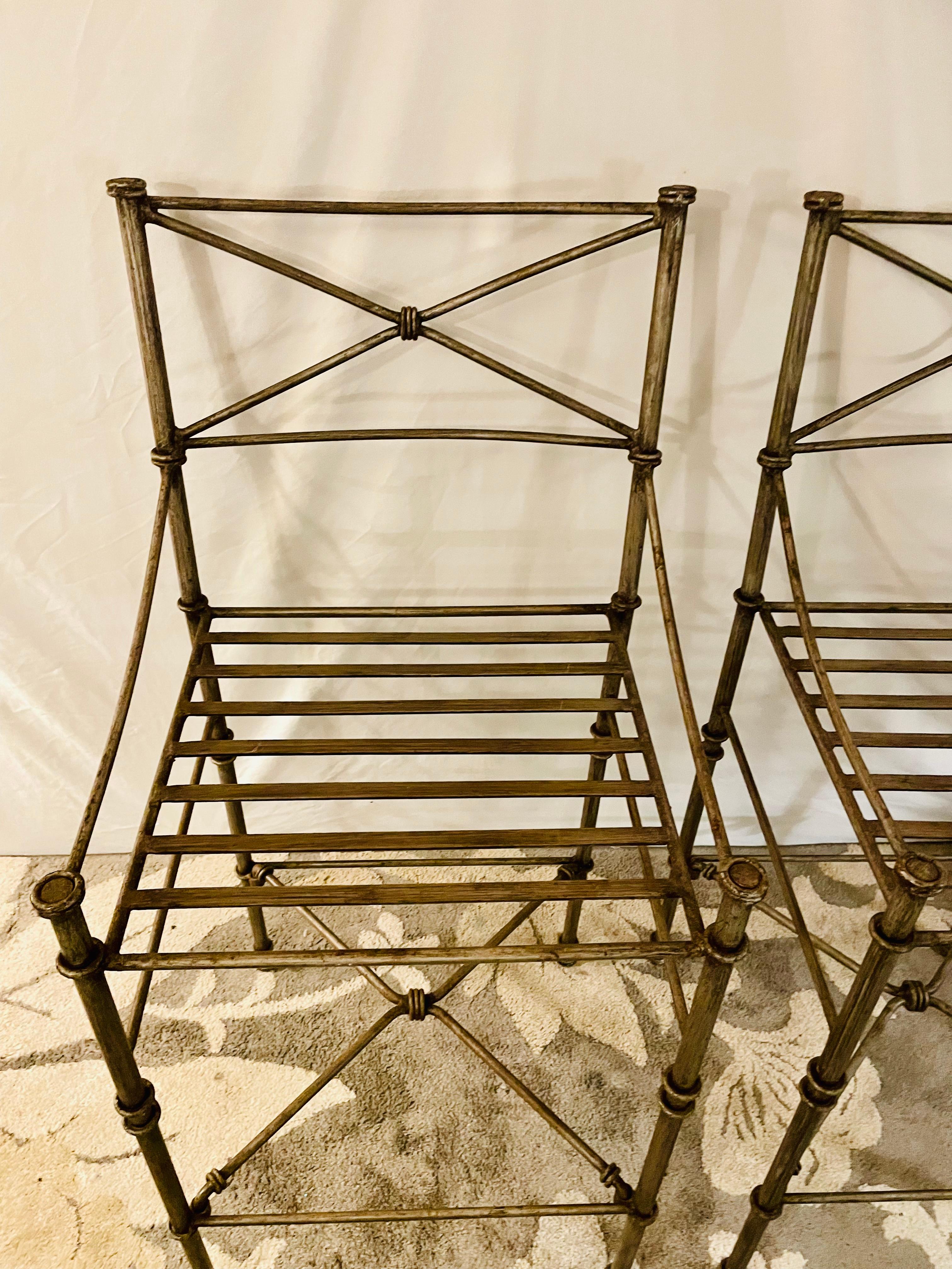 Giacometti inspired Wrought iron chairs A Set of 4 Bar Stool Dining Chairs

In stock and read to ship is this set of four heavy iron garden chairs, coated with an exquisite aged pewter style finish. This set is a great addition to any deck, garden,