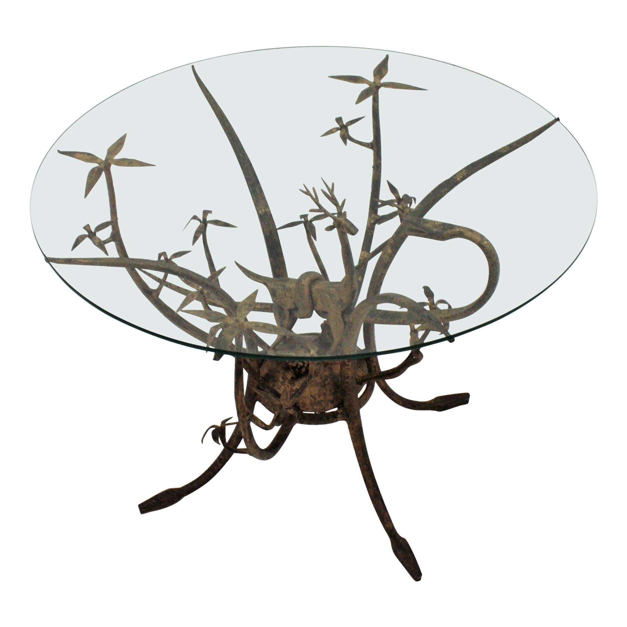 Wrought Iron Table with Figural Animals, France, 1960s.
One of a kind hand forged iron table with snakes and deer design and foliage accents.
Very much a work of art, as well as functional furniture, this wrought iron coffee table has a gourgeous