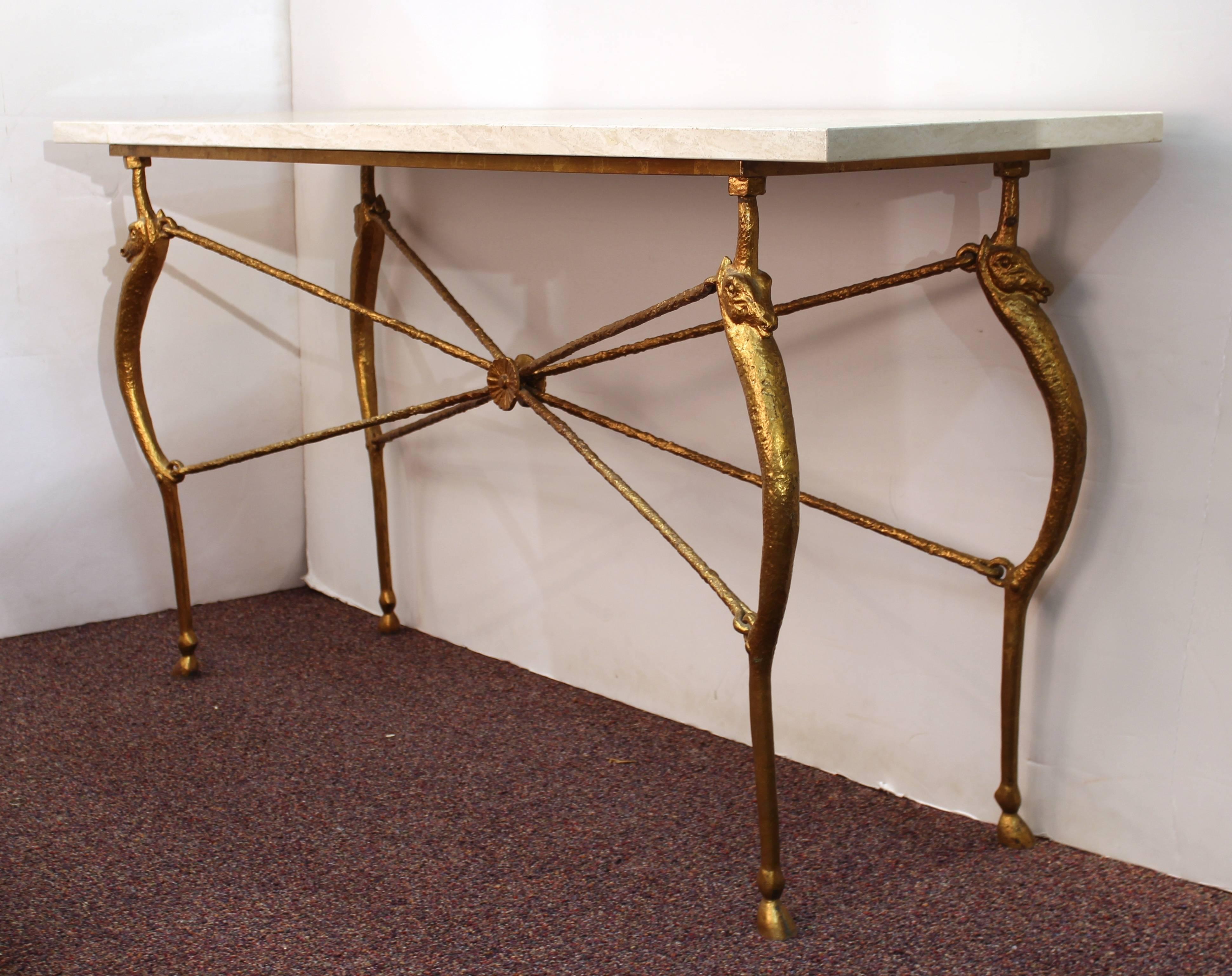 A monumental modern console with a marble top and a sculpted gilt bronze structure in the style of Giacometti. The piece is in great vintage condition.