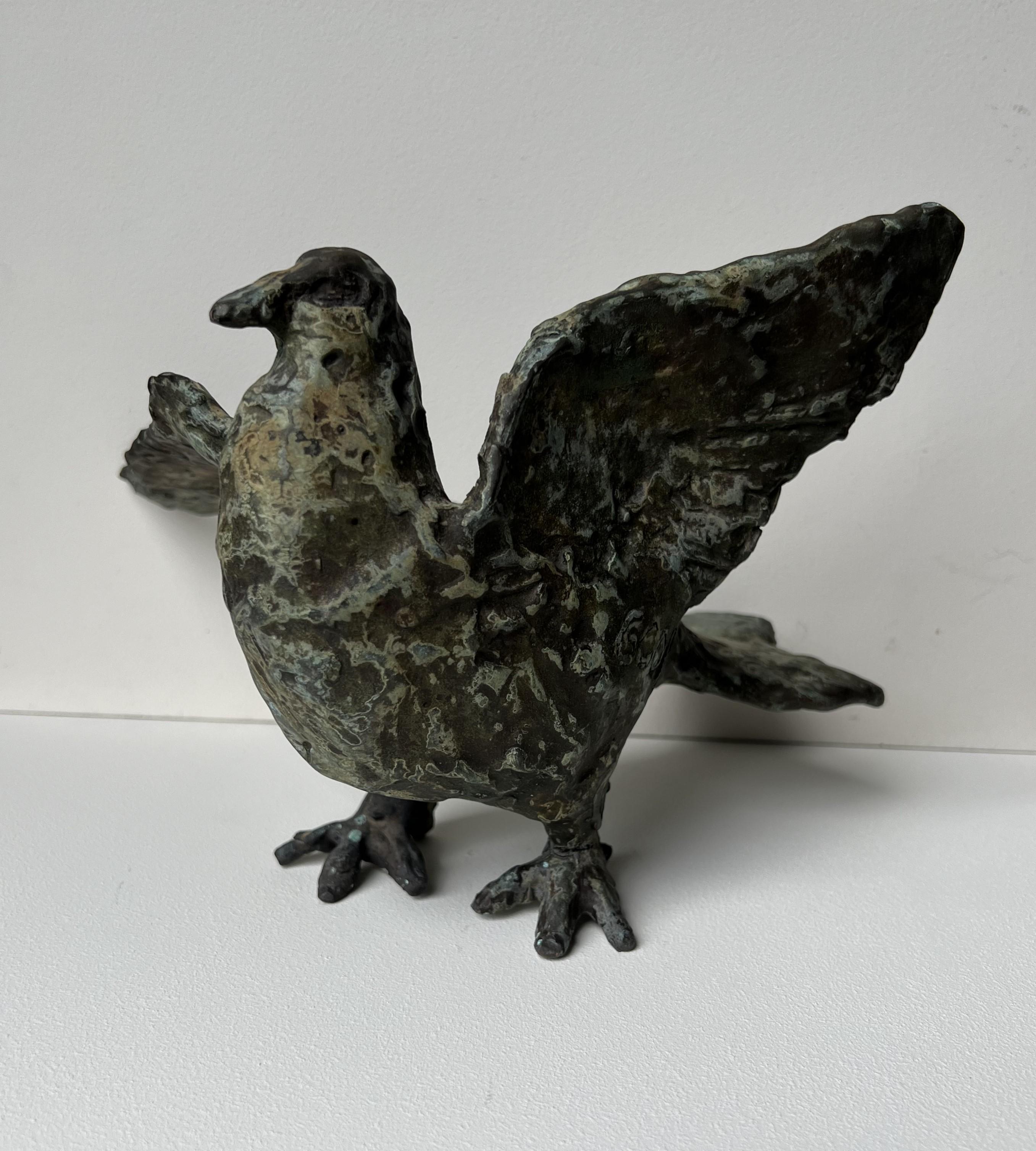 Beautiful and rare bronze sculptural piece by celebrated Israeli artist and sculptor, Ilana Goor. Giacometti-style sculpture made in solid bronze with beautiful patination and verdigris showing its unique character and age. Sculpture depicts a dove