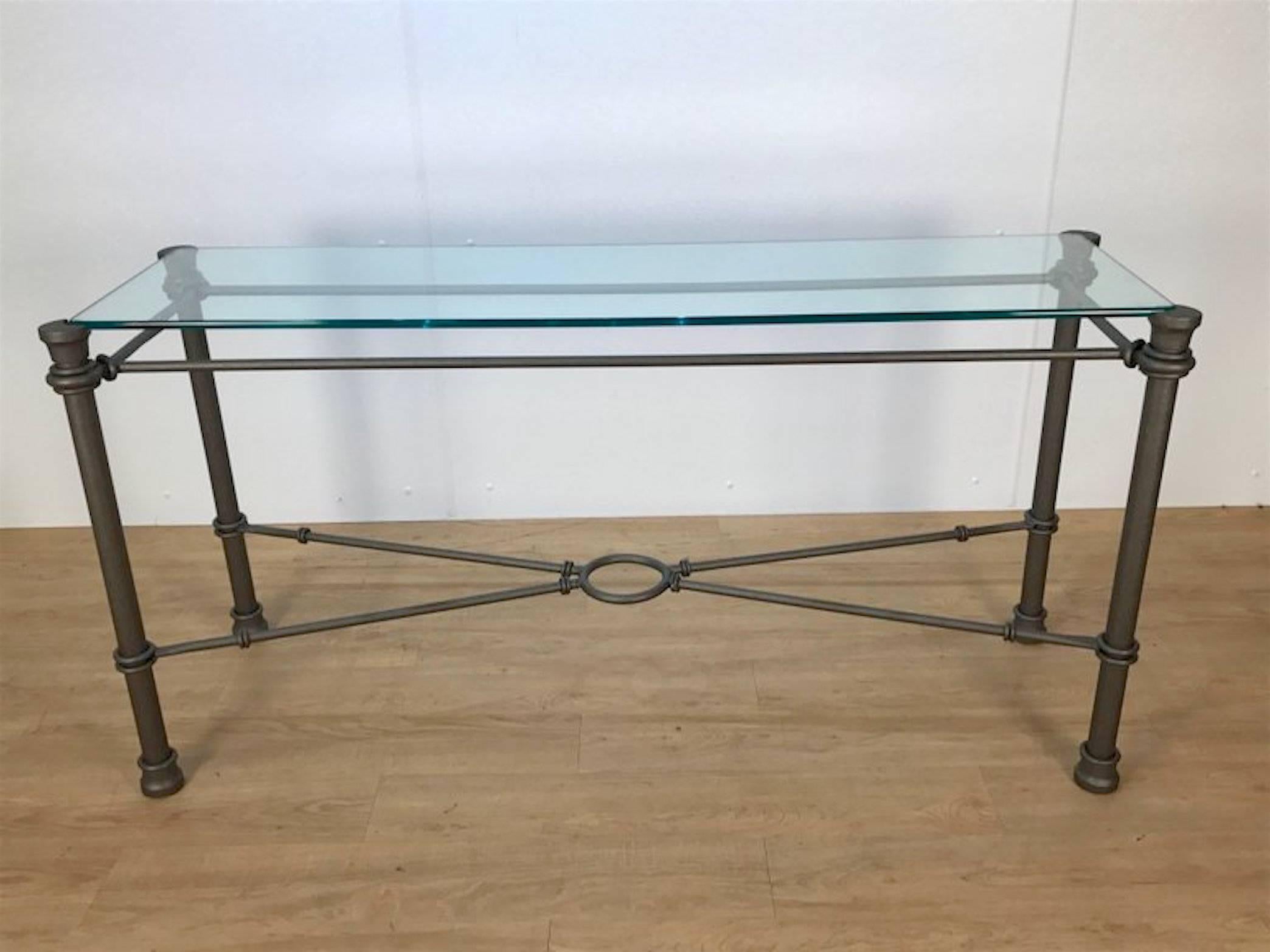 Giacometti style bronzed iron console table, in set glass top.