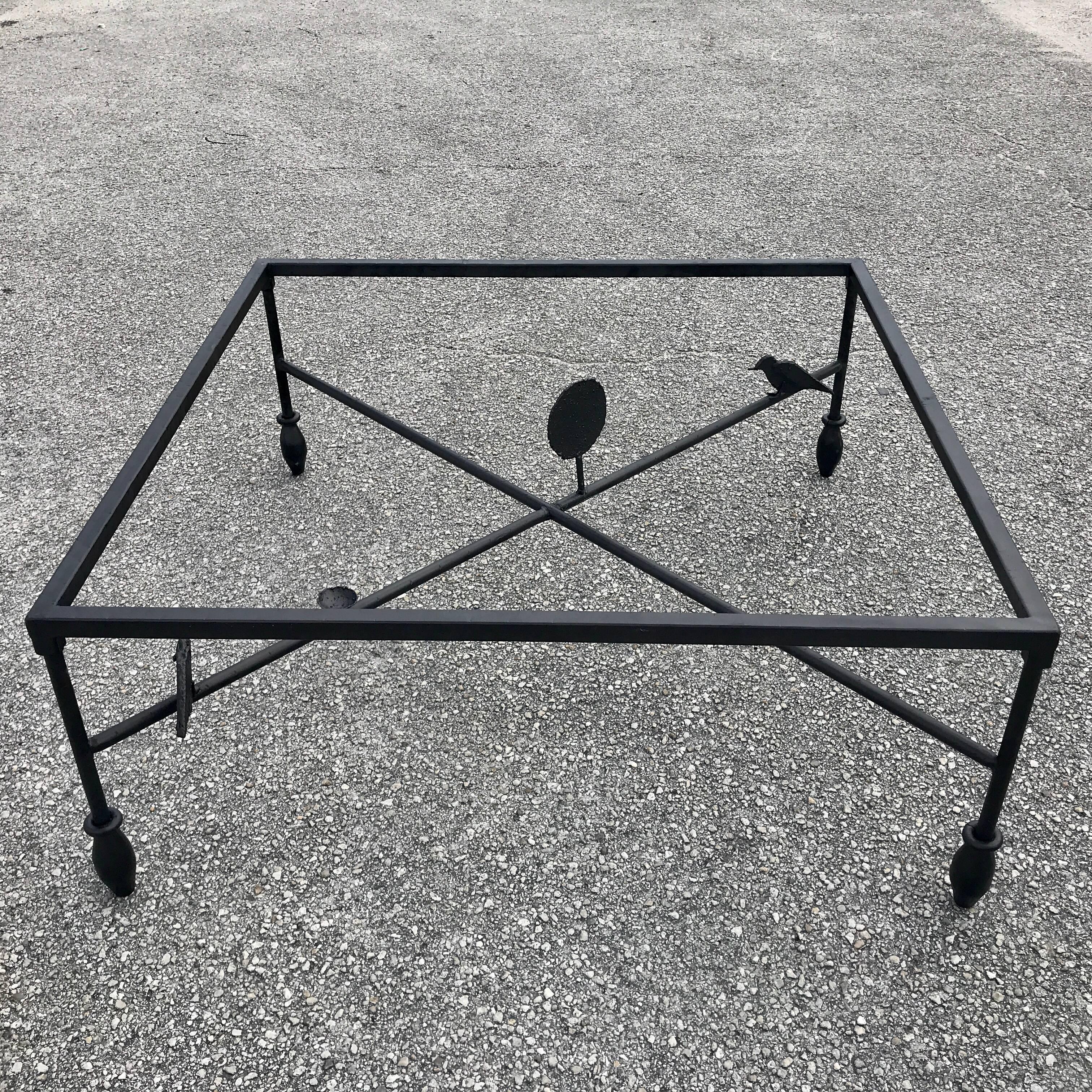 Giacometti style coffee table, oil rubbed bronze enameled wrought iron. Sold without glass. Please inquire with us for glass size suggestions or we can facilitate the acquisition of glass. Measures: 48