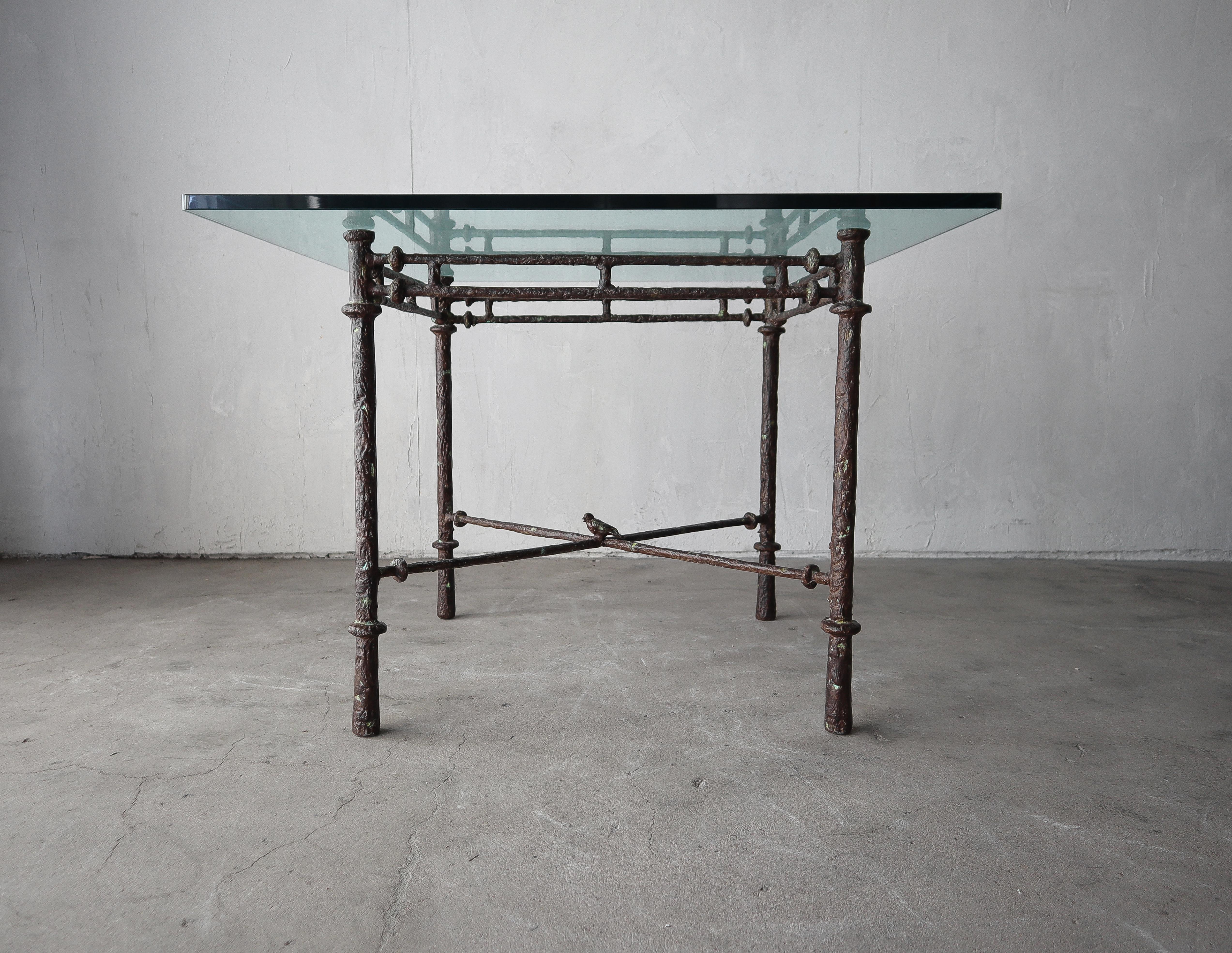 Absolutely stunning faux decorative bronze Dining table is the style of pieces by Diego Giacometti and Ilana Goor. Table is super designer and has a very classy look. The metal, finish and bird details add significant interest.

Base is in