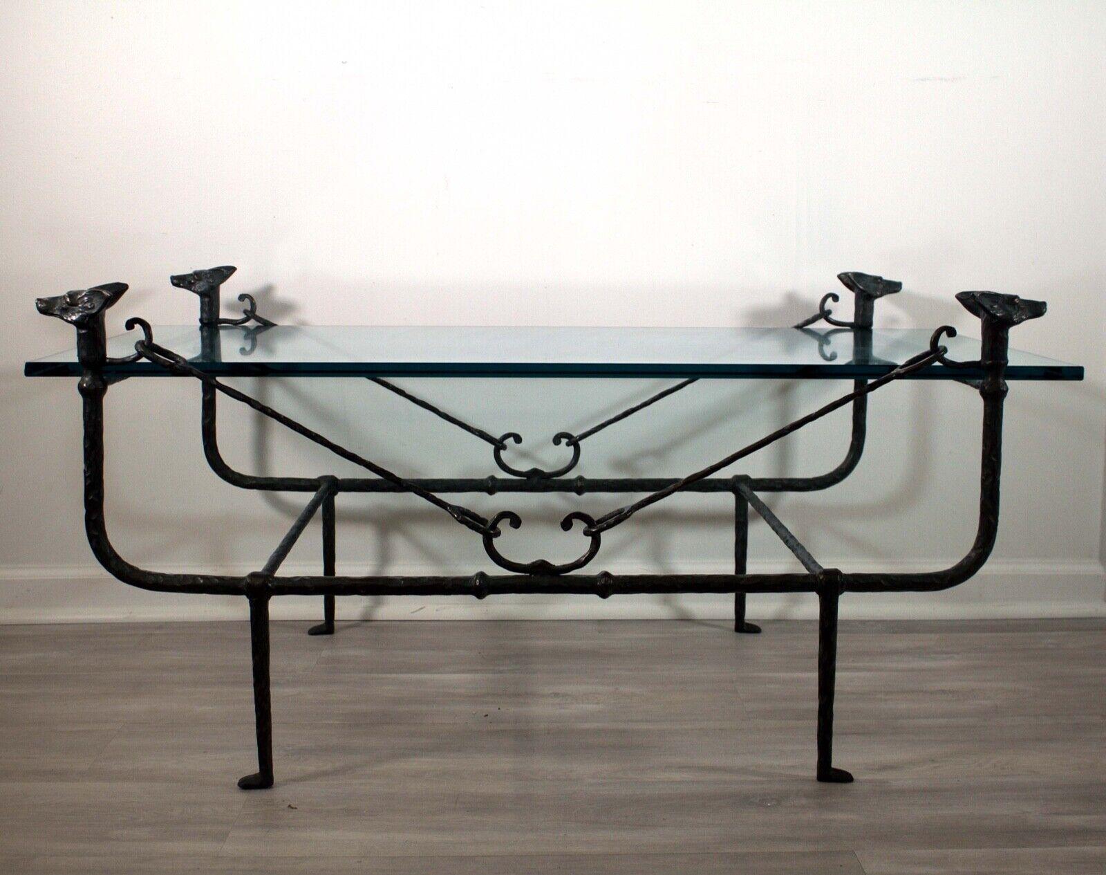 This classic Giacometti style wrought iron coffee table by Paul Ferrante is a timeless piece that will bring a touch of sophistication to any interior. The table is composed of an intricate and delicate wrought iron frame, with a blackened finish