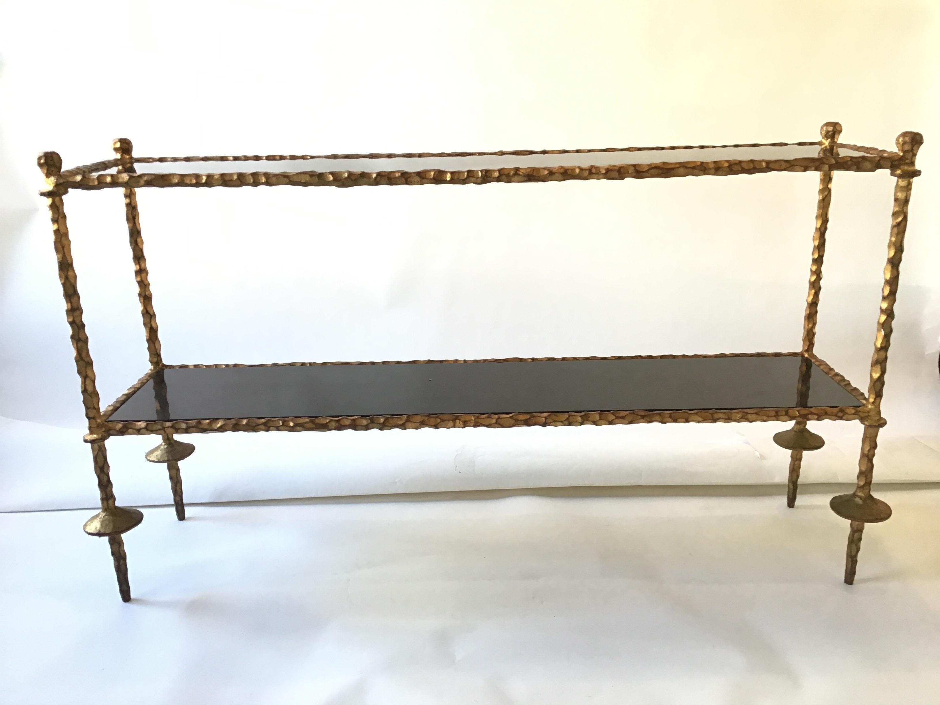Giacometti style gilt iron and granite two tier console. Great quality piece.