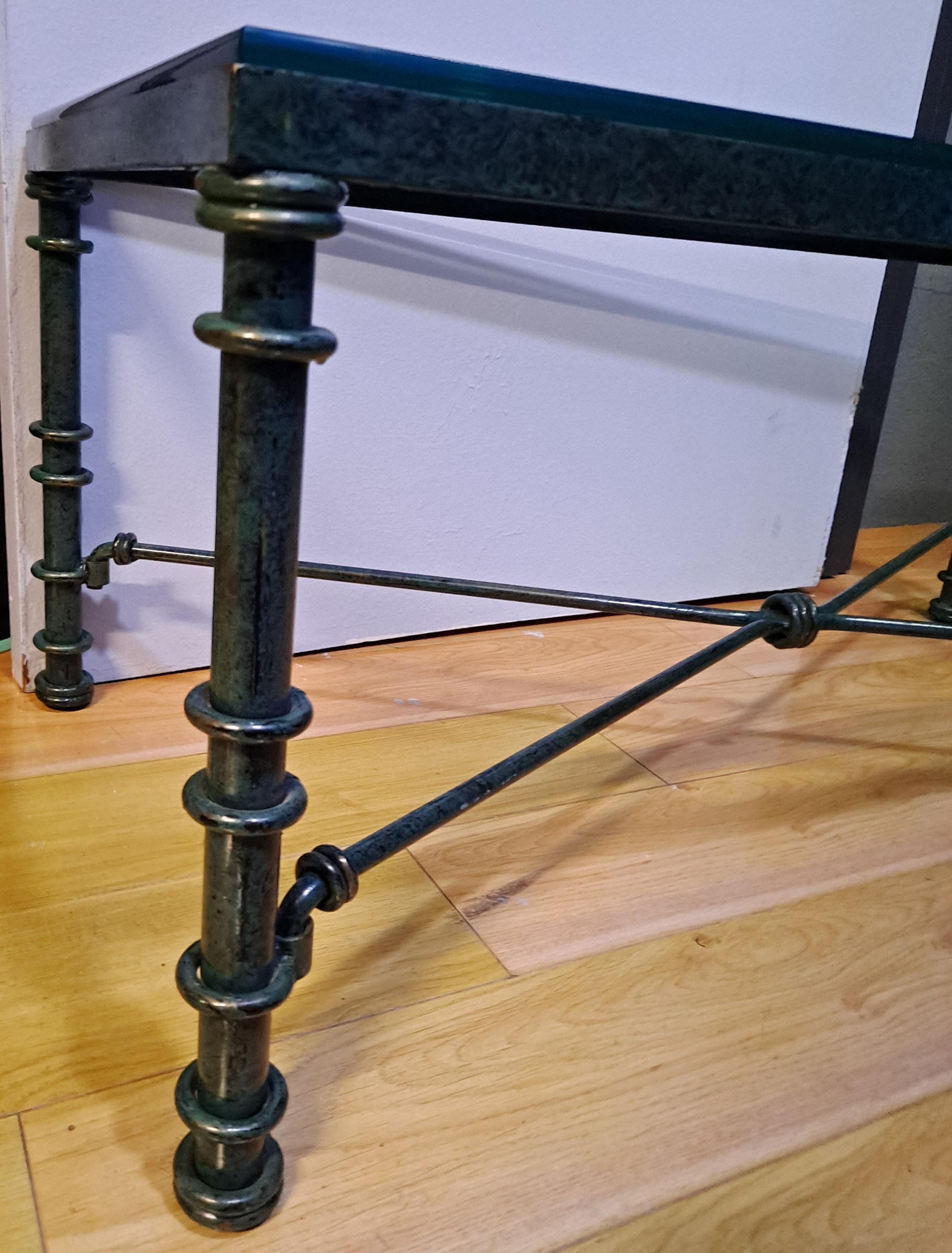 Giacometti-Style Iron Coffee Table With Verdigris Finish and Glass Top

There is a chip on one of the corners of the glass and a small crack on opposite corner

40 x 20 x 16.5