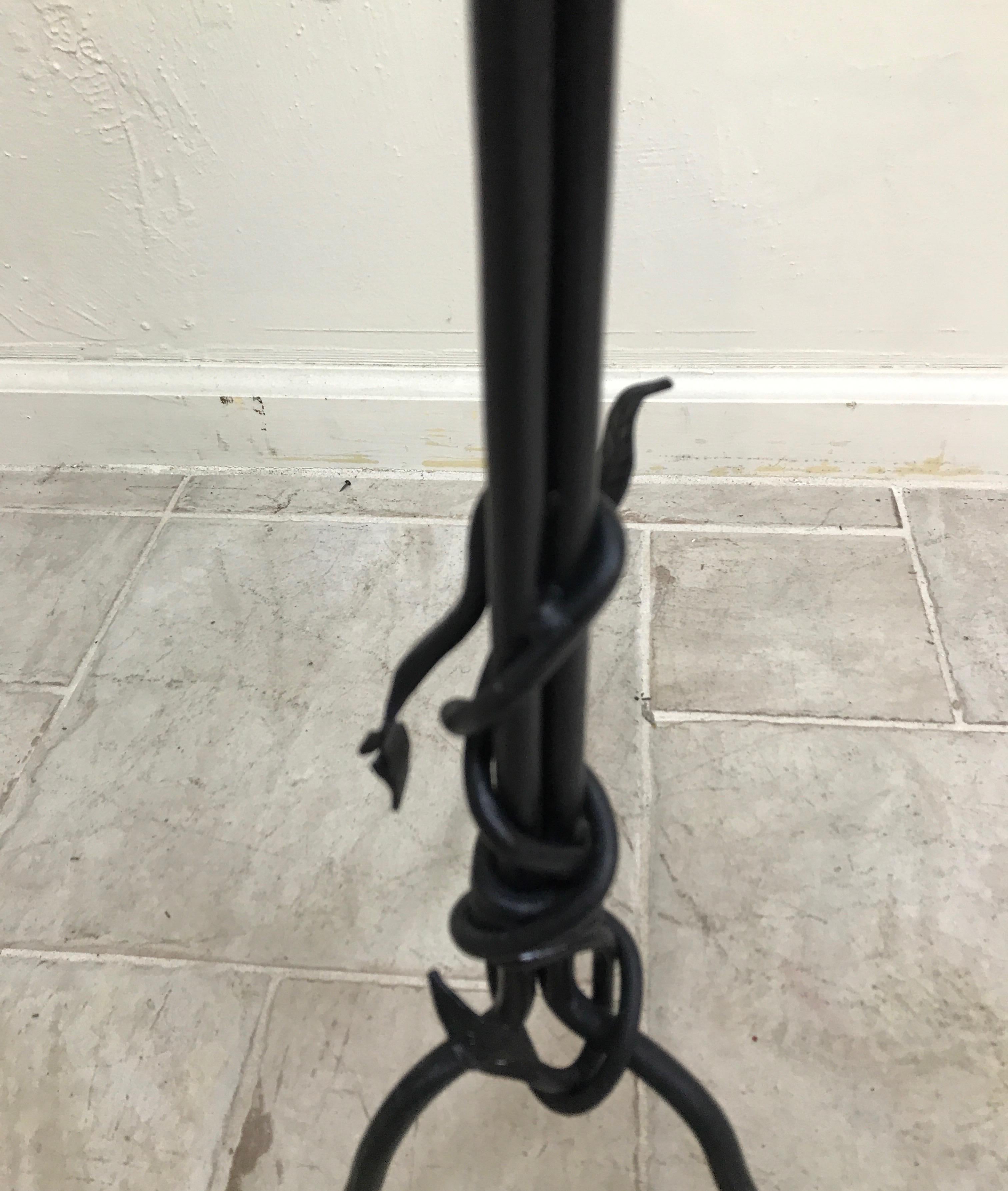 Black painted iron table with glass top in the sculptural style of Giacometti.