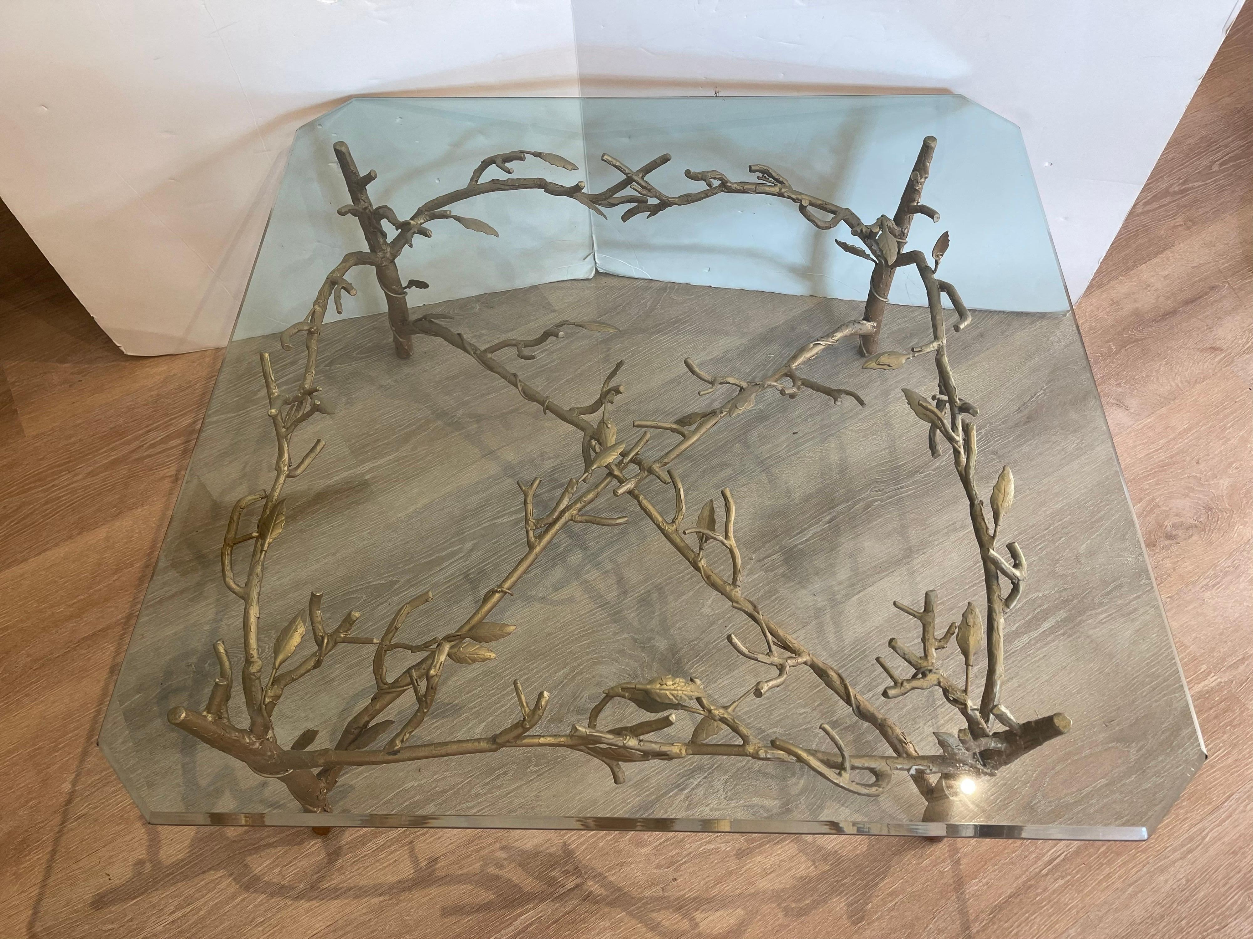 Elegant handmade wrought iron with glass top Alberto Giacometti style glass top cocktail / coffee
table. Features carved tree branches under glass. Great scale and better lines. Now, more than ever,
home is where the heart is.