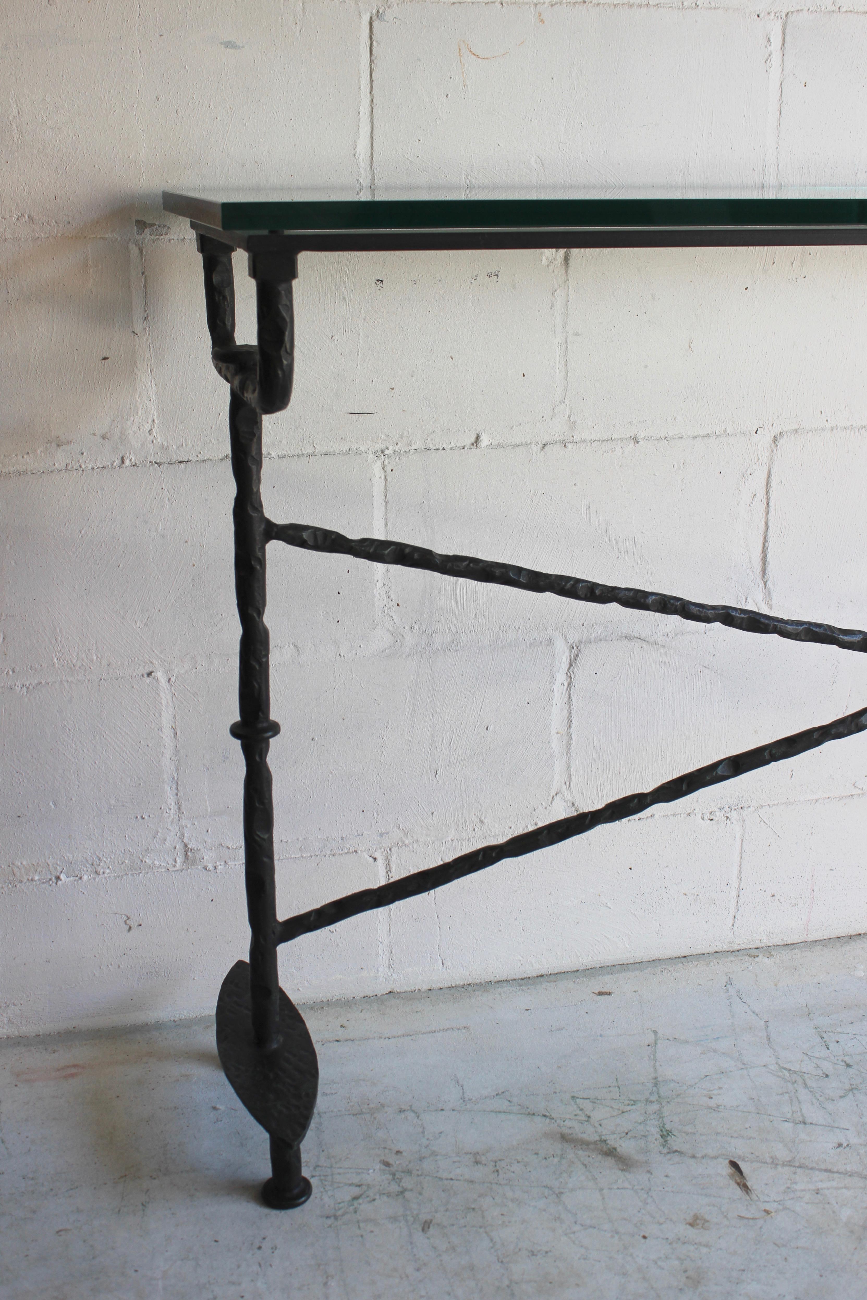 Giacometti style patinated bronze console table with glass top.