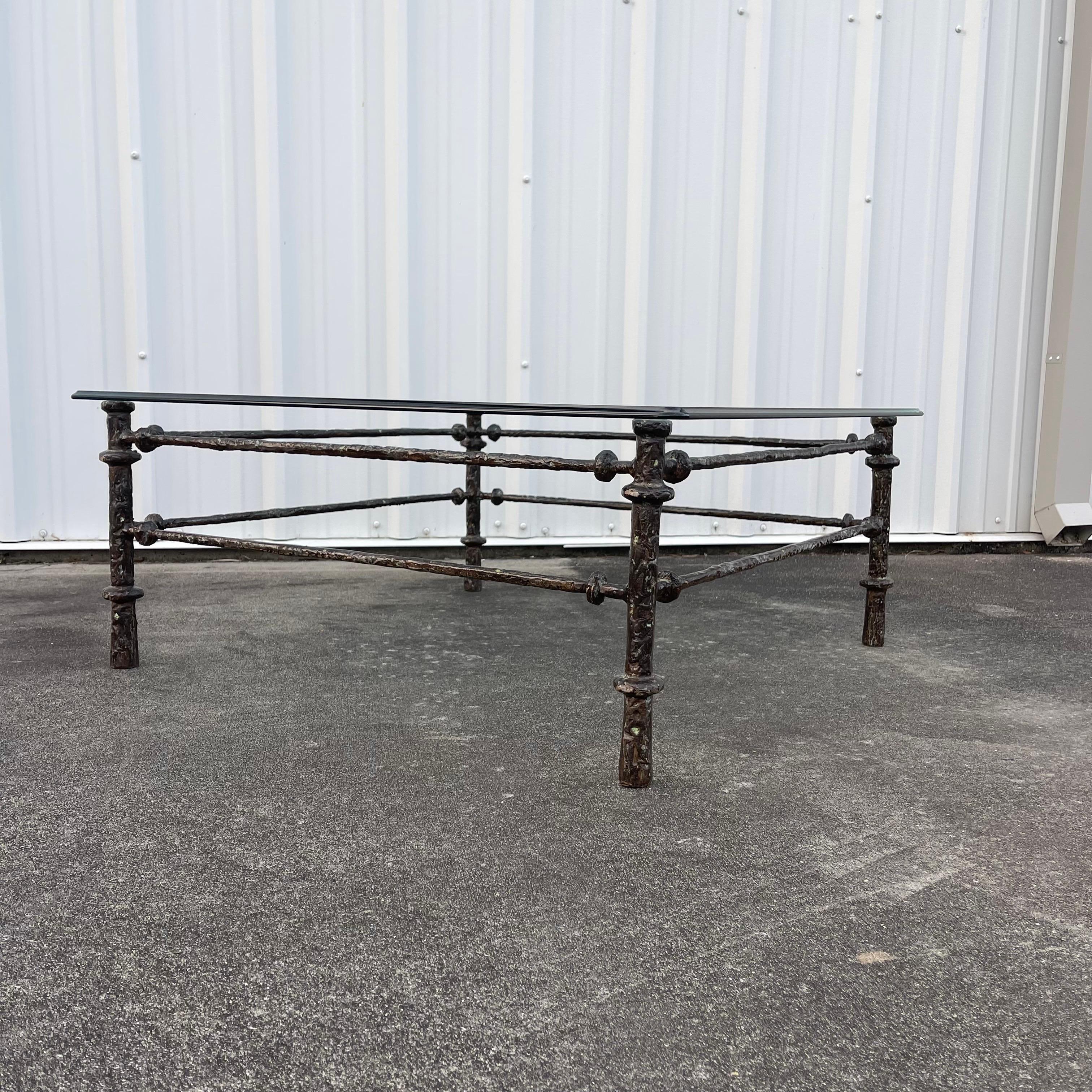 Coffee table in the style of Giacometti, with a patinated bronze finish over a base metal (likely aluminum).

If preferred, table base can be sold without glass and shipped via UPS to the continental United States. Cost will be approximately $299.