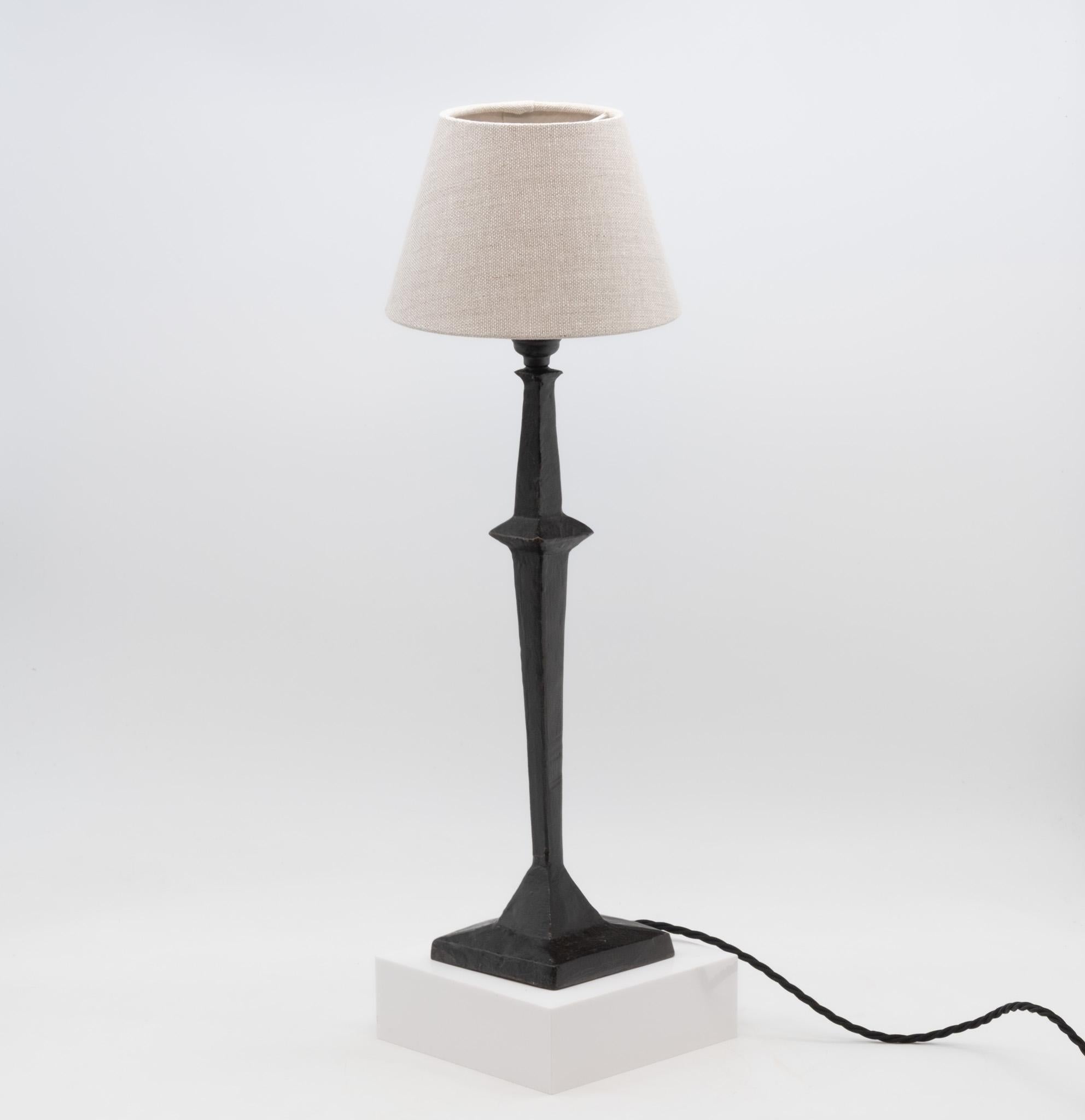 Giacometti style black patinated bronze table lamp. Circa 2000.

The lamp has been rewired, with new bayonet and UK plug. PAT tested.

Overall in very good condition, showing some light signs of use. Shade not included.

UK delivery
