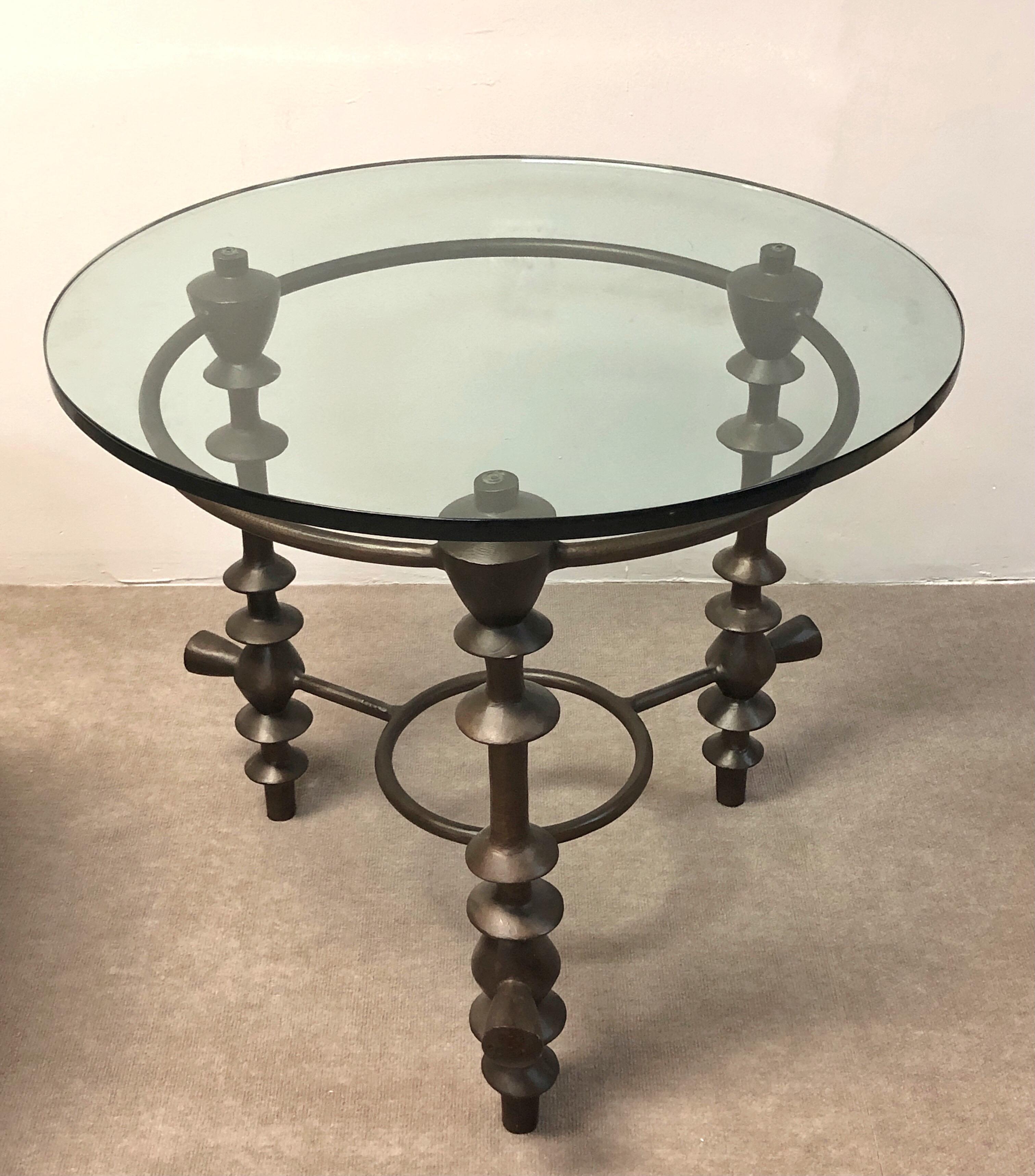 A great looking sculptural table. Solid metal with a bronze patina.