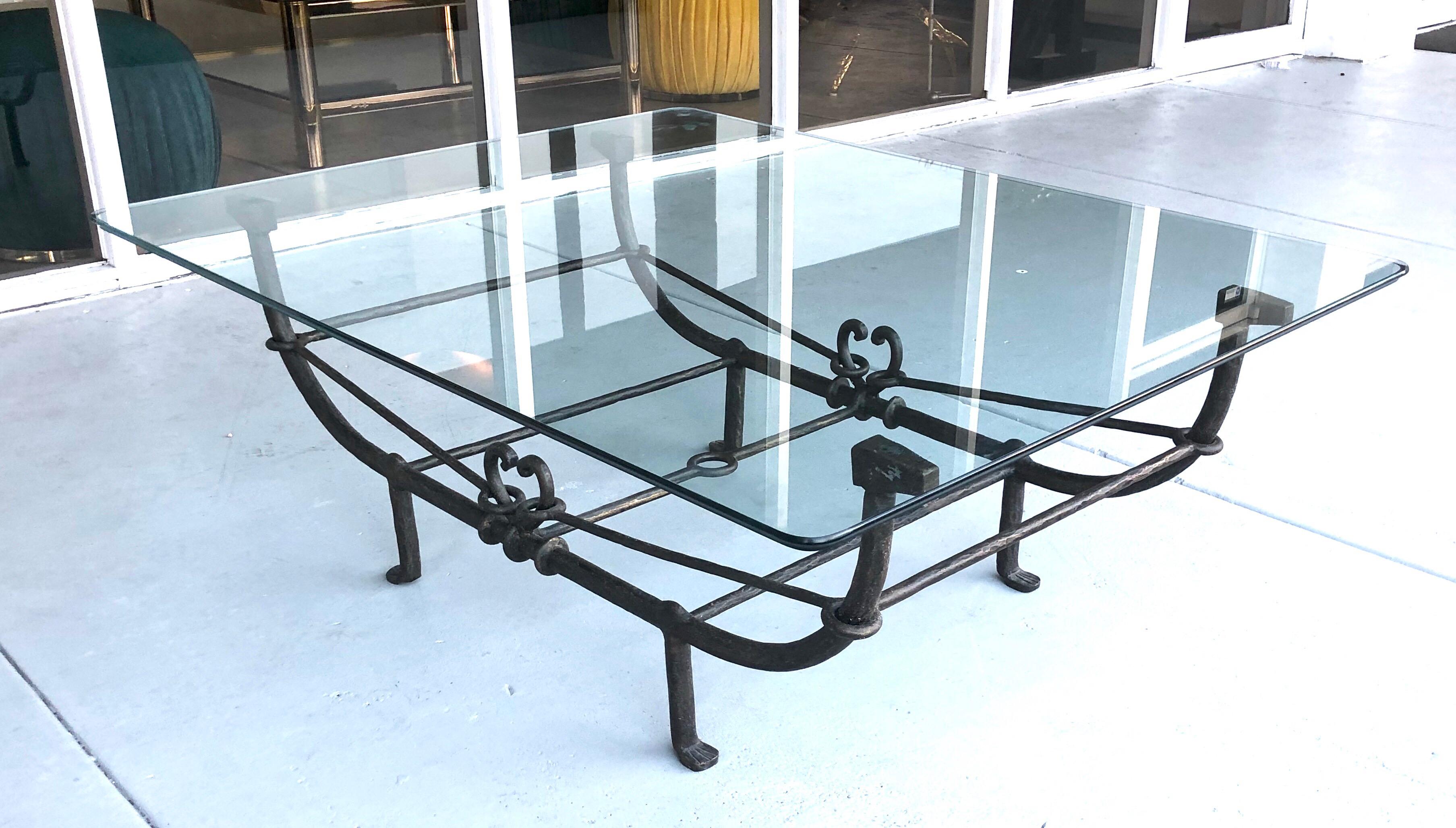 A large coffee table. Steel base with a bronze patina. Nice detail and top craftsmanship. Could hold a larger glass top. Metal base measures 46