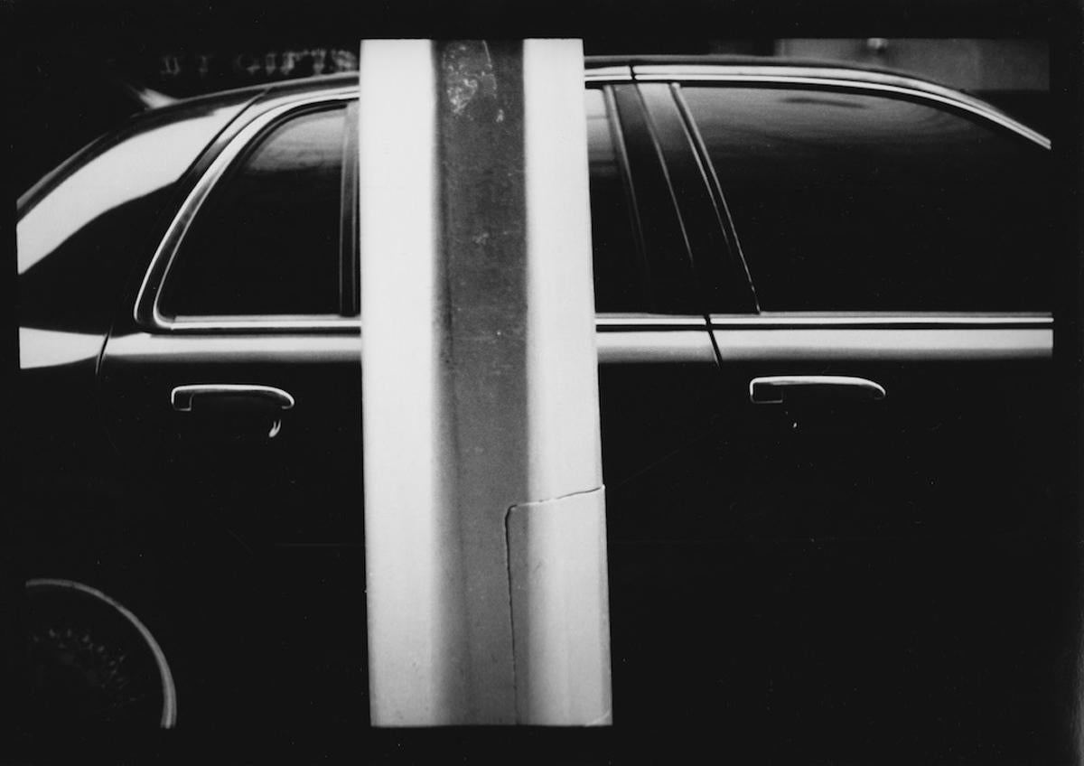 Giacomo Brunelli Black and White Photograph - Untitled #13 (Car and Pole) from New York - Black and White, Street Photography