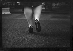 Untitled #13 (Woman's Legs Soho Square) from Eternal London - Giacomo Brunelli