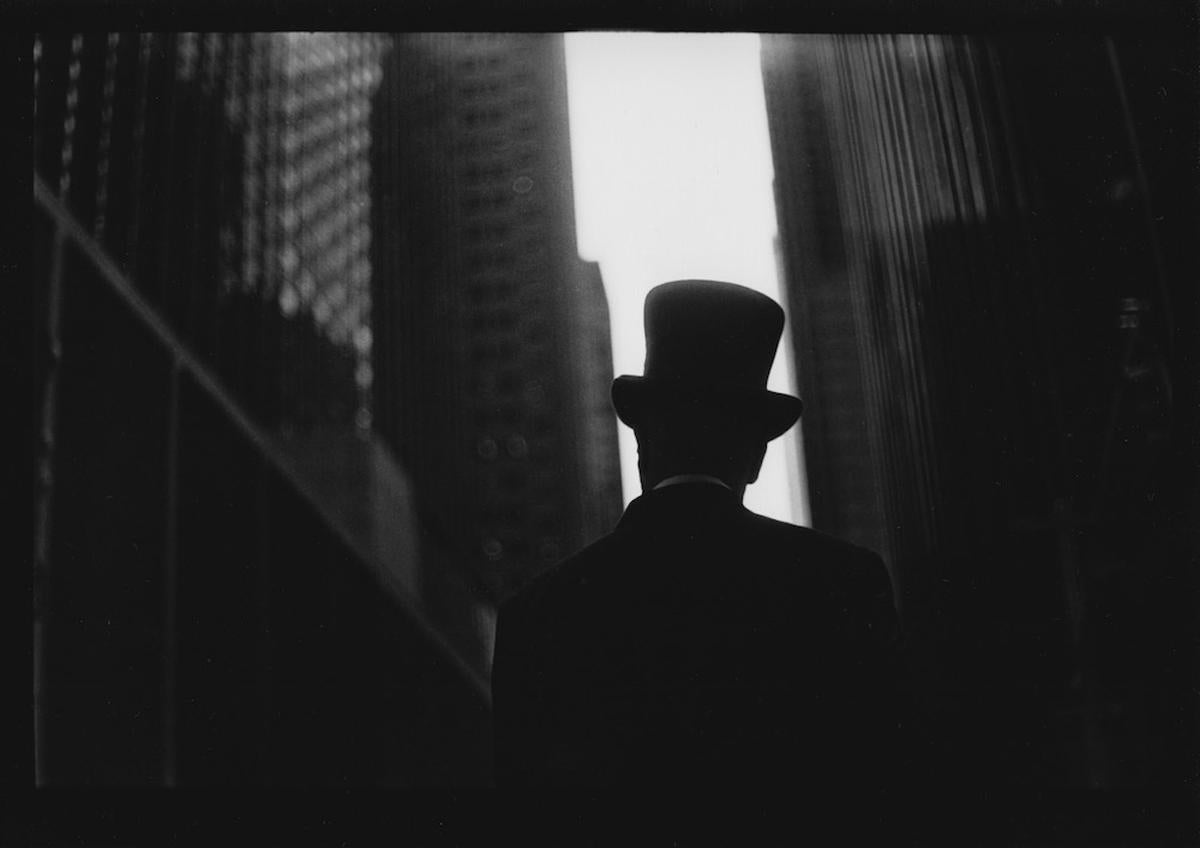Giacomo Brunelli Black and White Photograph - Untitled #21 (Man's Hat and Skyscrapers) from New York - Black and White Photo