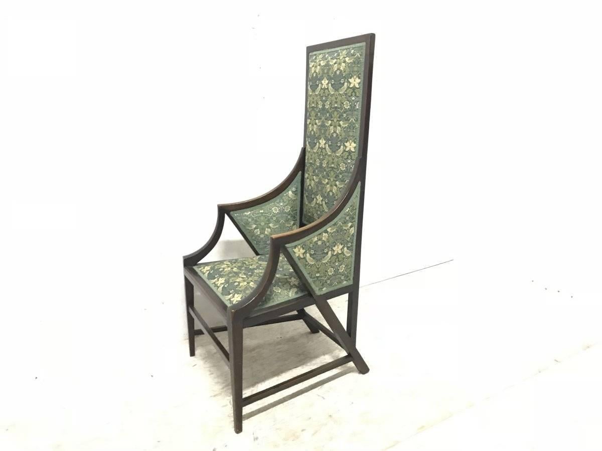 Giacomo Cometti. A sophisticated Anglo-Japanese style armchair of angular design. The high back sits on the back of the back legs which in turn connects to the arms through the seat forming stylistic wing shapes, which in turn connect to the front