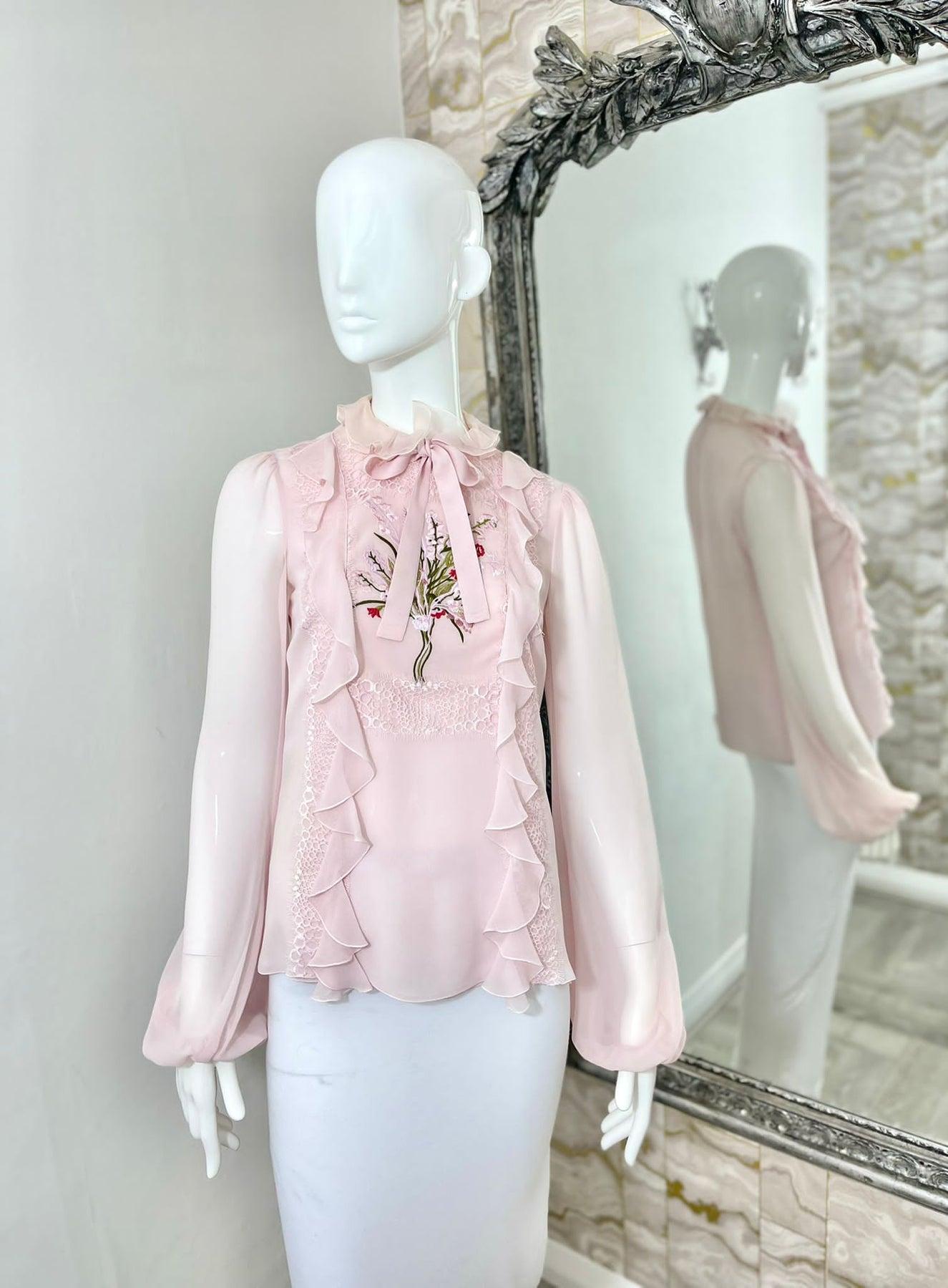 Giambatista Valli Silk & Embroidered Georgette Blouse

Sheer pink, ruffle high neck blouse with pussy bow and floral embroidery

Additional information:
Size – 38IT
Composition- Silk
Condition – Very Good
