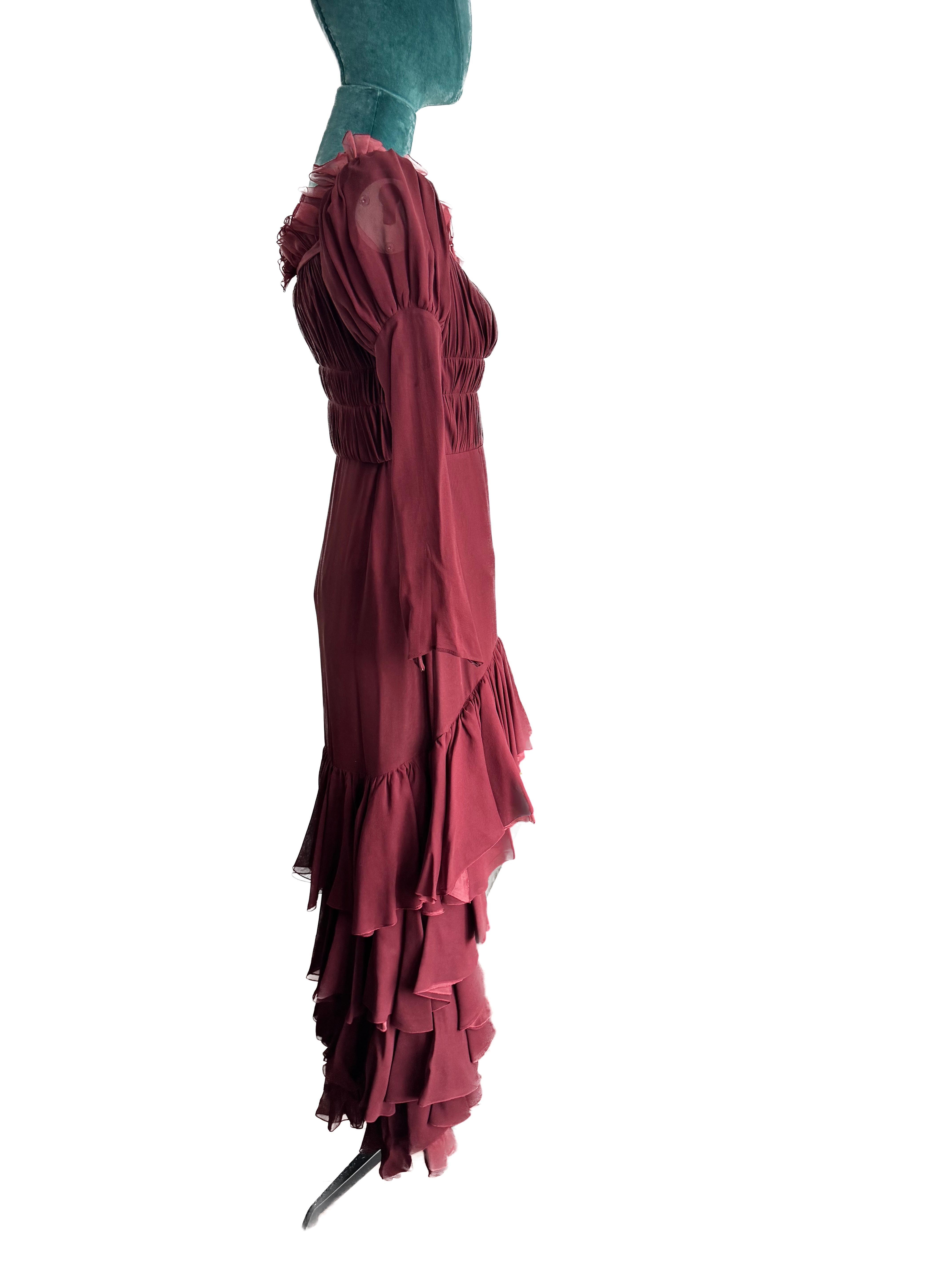 Giambattista Valli's 2018 runway burgundy chiffon ruffle dress was a breathtaking ensemble that epitomized elegance and romance. Crafted with meticulous attention to detail, this dress was a stunning manifestation of the designer's signature