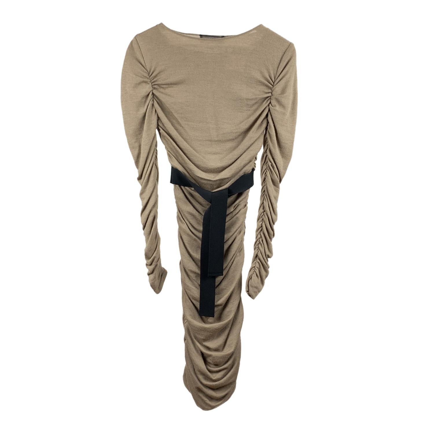 Giambattista Valli knit dress with draping in beige color. Contrast gros-grain belt. Boat neckline. Long sleeve styling. Lined with a stretch fabric. Side zip closure. Composition: 70% Wool, 10% Silk, 10% Cashmere. Size: 40 IT, XS

Details

STYLE: